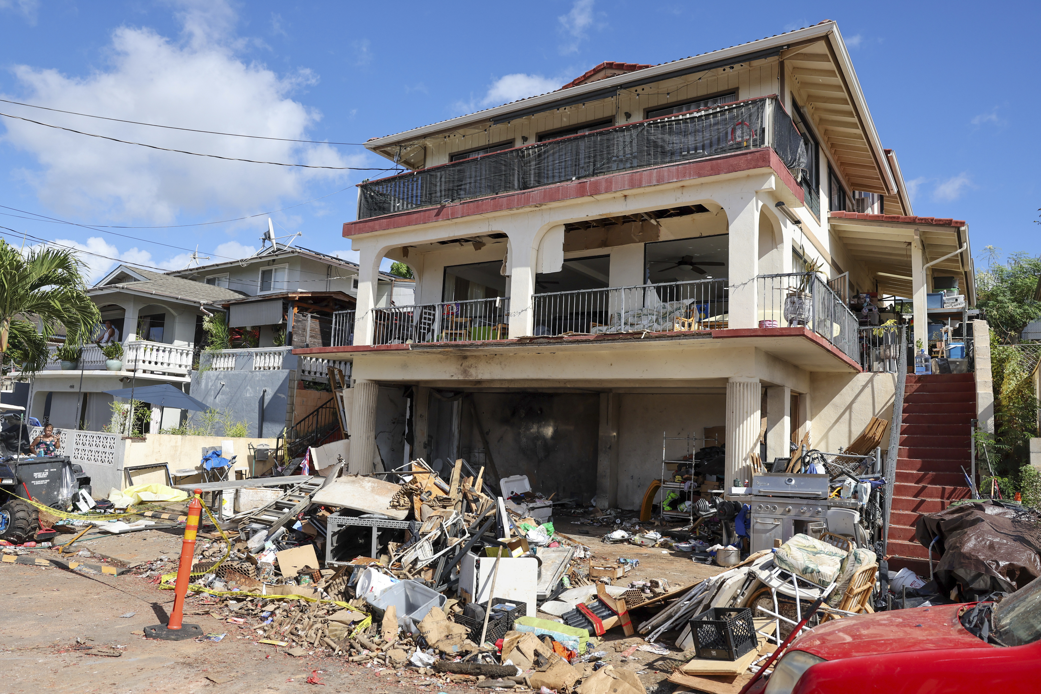 A view of the home where a New Year's Eve fireworks explosion killed and injured people, Wednesday, Jan. 1, 2025, in Honolulu. (AP Photo/Marco Garcia)