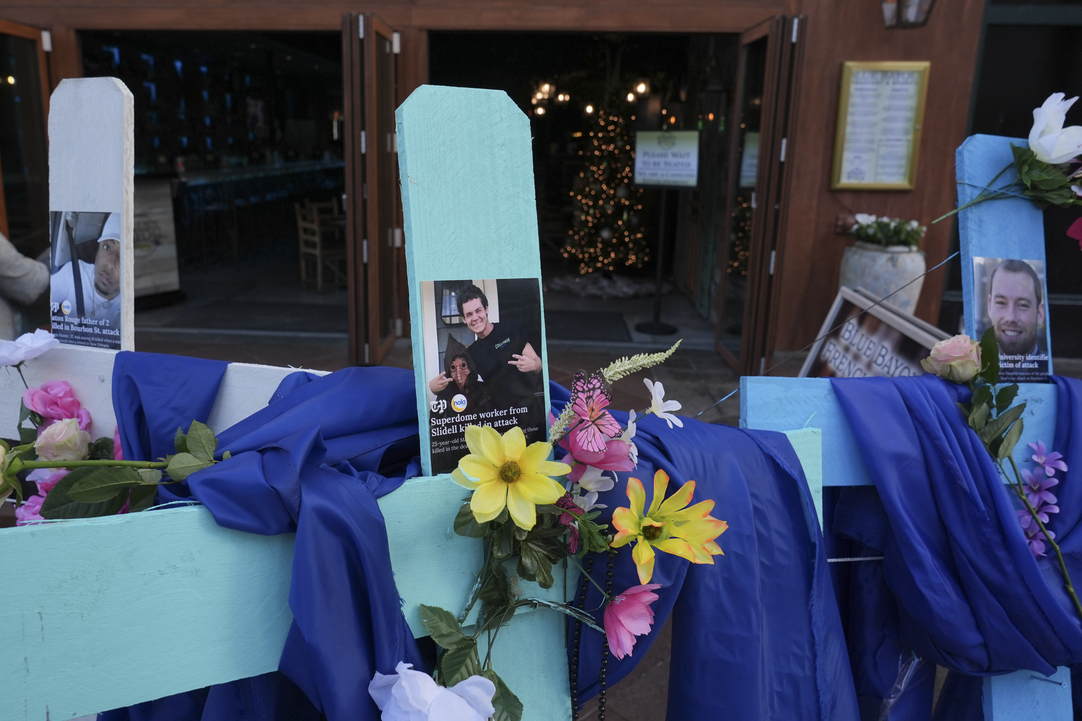 A memorial to the victims of a deadly truck attack is seen on Canal Street in the French Quarter, Friday, Jan. 3, 2025, in New Orleans. (AP Photo/George Walker IV)