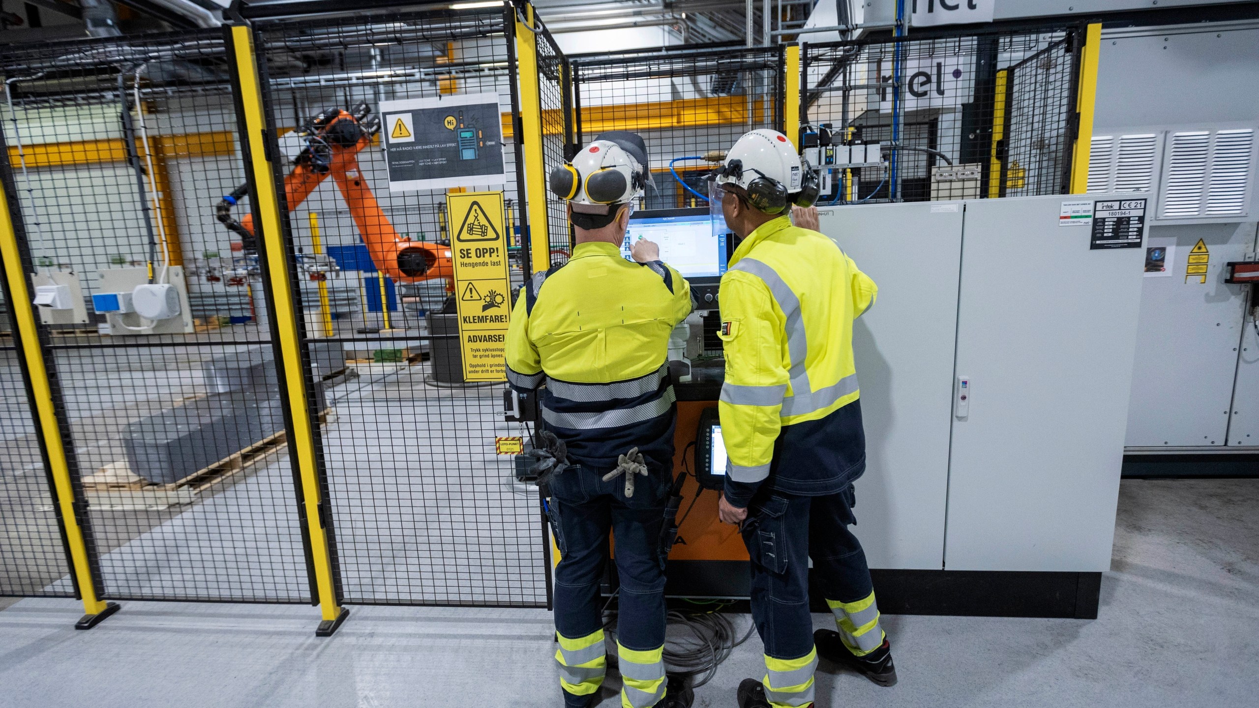 FILE - Employees work at a facility for the Norwegian company Nel in Heroya, Norway, on April 20, 2023. (AP Photo/Trond R. Teigen, File)