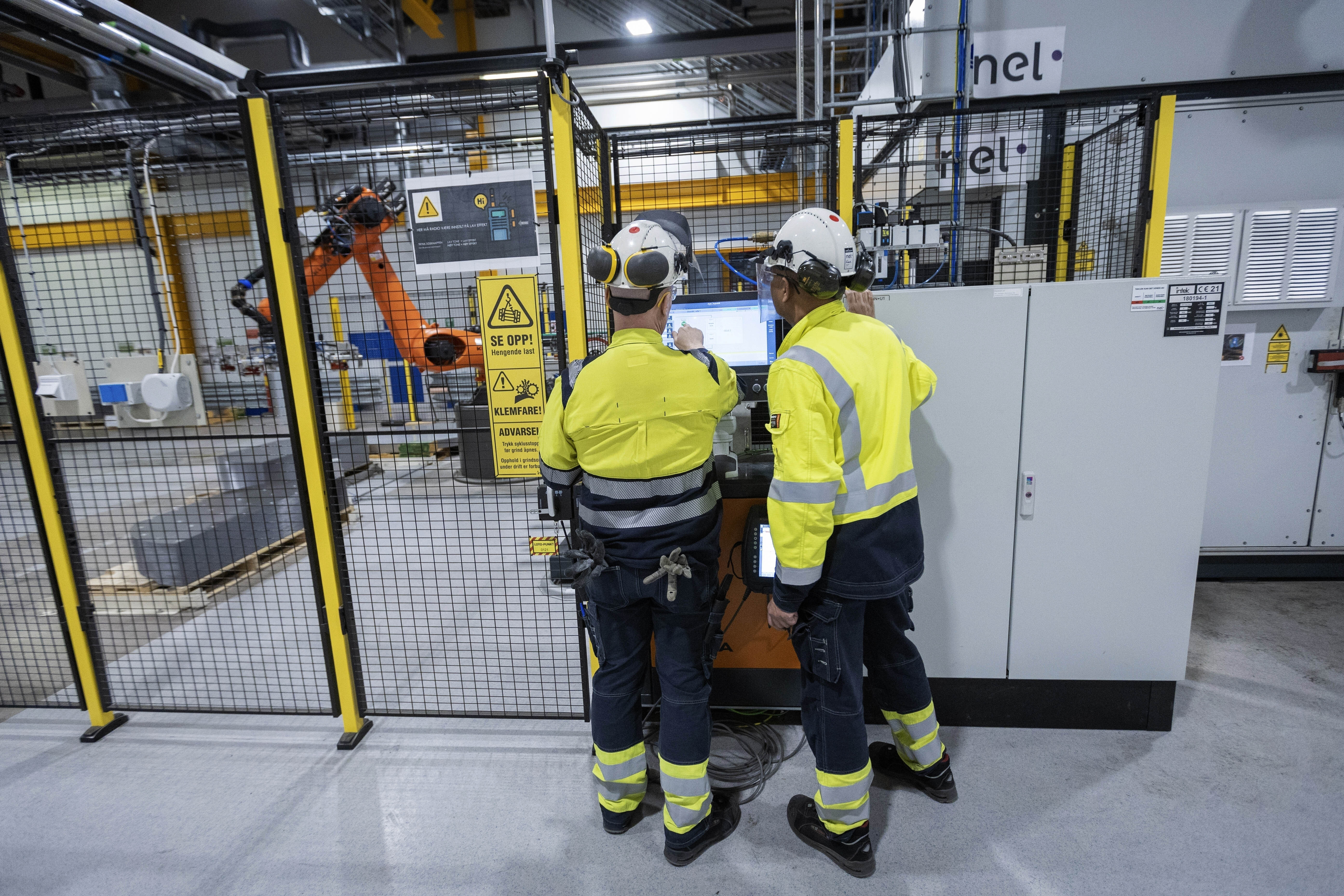 FILE - Employees work at a facility for the Norwegian company Nel in Heroya, Norway, on April 20, 2023. (AP Photo/Trond R. Teigen, File)