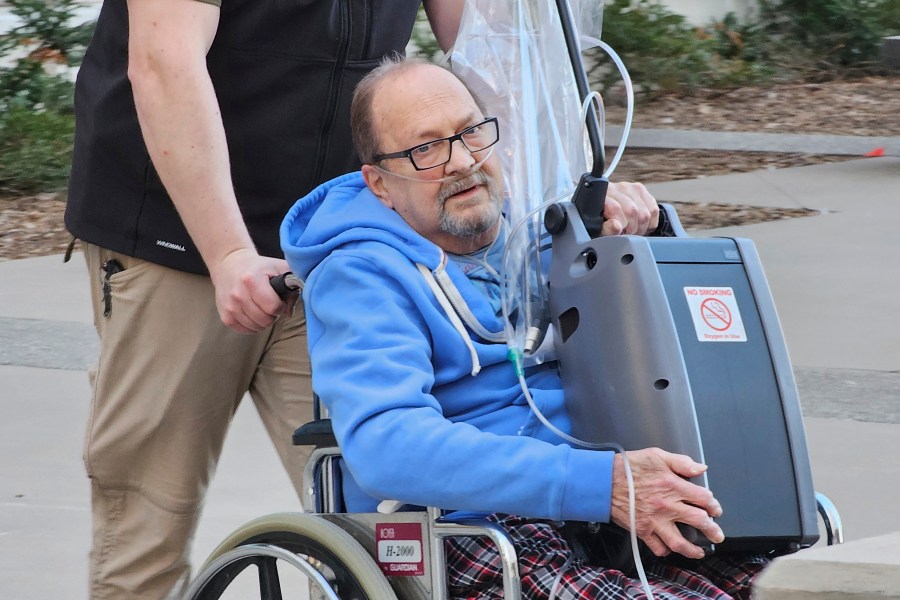 FILE - Jerry Hal Saliterman, of Crystal, Minn., is wheeled out of U.S. District Court in St. Paul, Minn., Friday, March 15, 2024, after he made his initial appearance on charges connected to the 2005 theft of a pair of ruby slippers worn by Dorothy in "The Wizard of Oz." (AP Photo/Steve Karnowski, File)