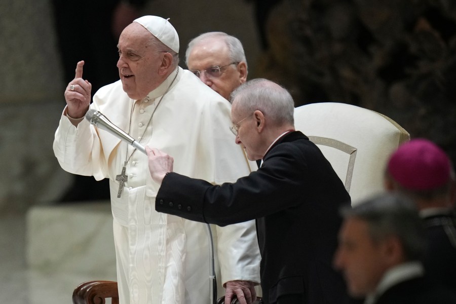 Pope Francis gestures during an audience with Catholic associations of teachers and students' parents in the Paul VI Hall, at the Vatican, Saturday, Jan. 4, 2025. (AP Photo/Alessandra Tarantino)