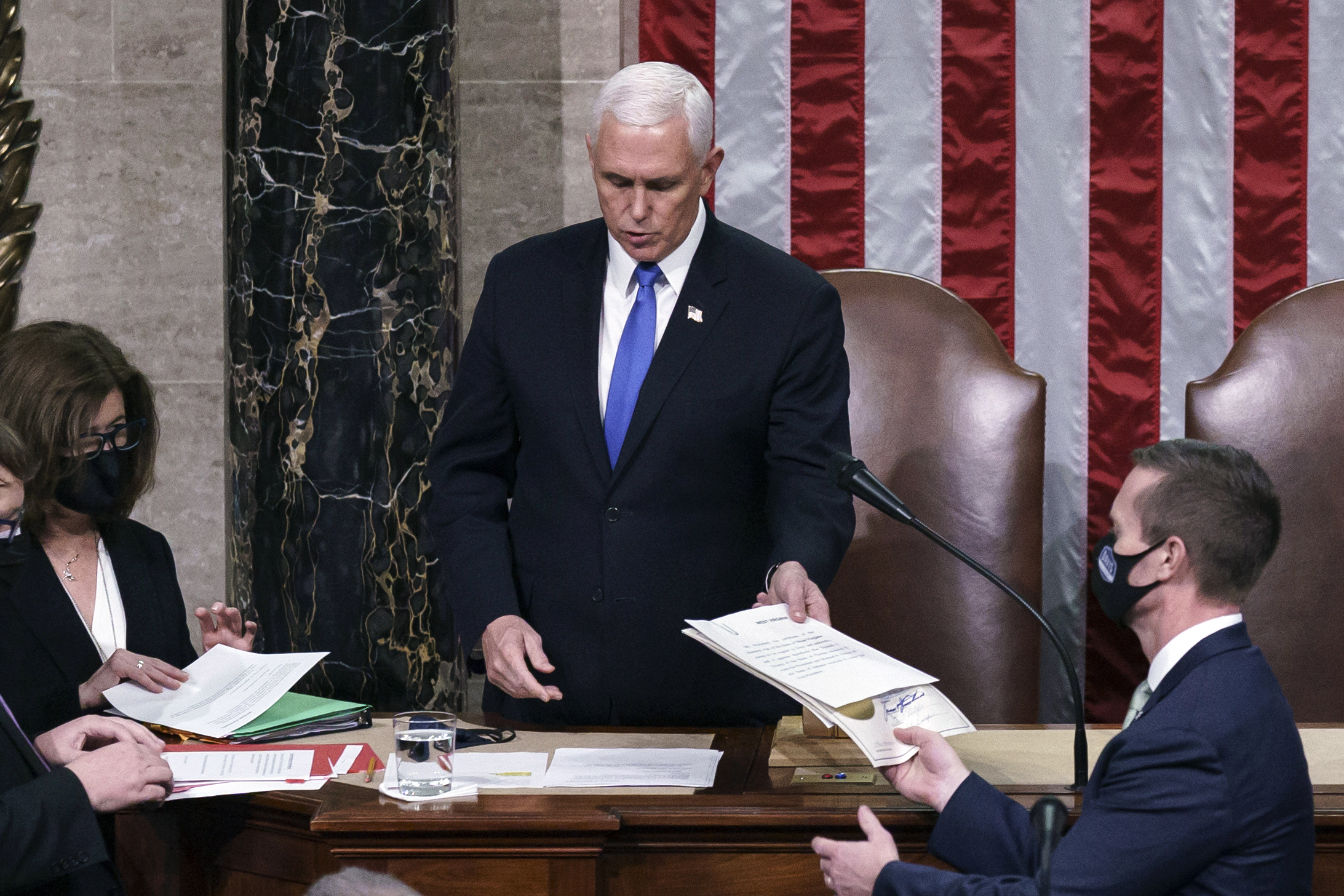 FILE - Vice President Mike Pence returns to the House chamber after midnight, Jan. 7, 2021, to finish the work of the Electoral College after a mob loyal to President Donald Trump stormed the Capitol in Washington and disrupted the process. (AP Photo/J. Scott Applewhite, File)