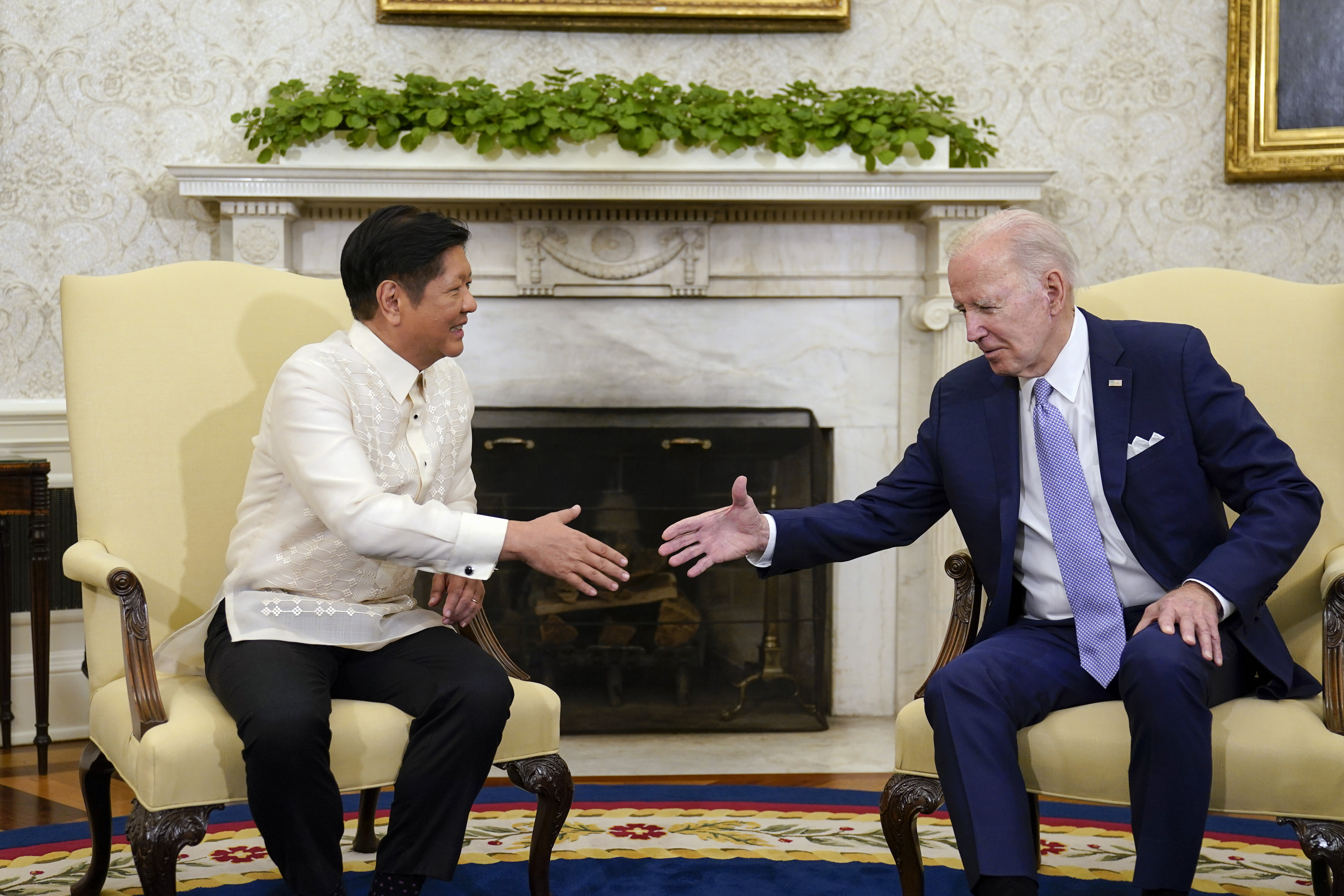 FILE - President Joe Biden, right, shakes hands with Philippines President Ferdinand Marcos Jr. as they meet in the Oval Office of the White House in Washington, on May 1, 2023. (AP Photo/Carolyn Kaster, File)