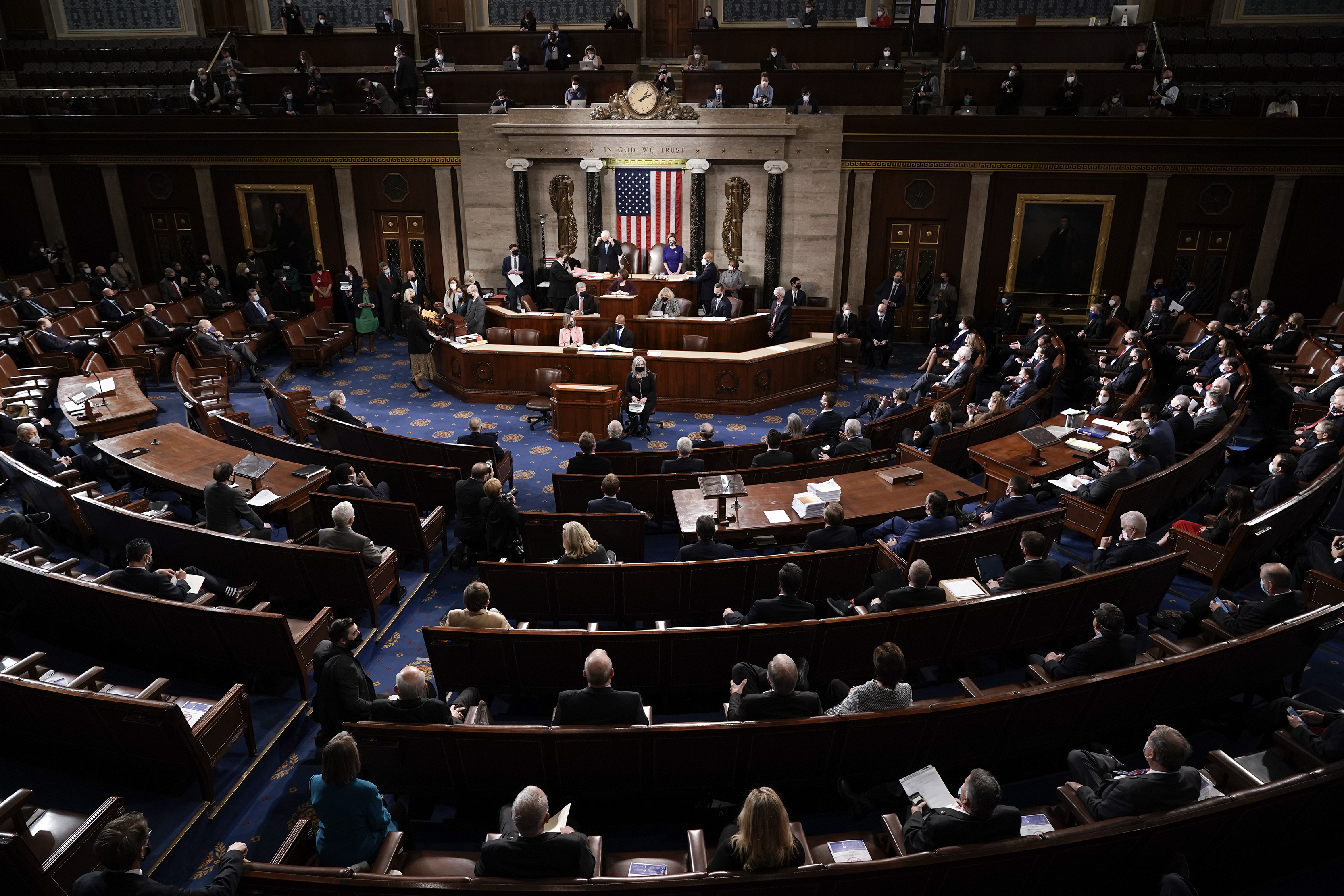 FILE - Vice President Mike Pence and Speaker of the House Nancy Pelosi, D-Calif., officiate as a joint session of the House and Senate convenes to count the Electoral College votes cast in the presidential election, at the Capitol in Washington, Jan. 6, 2021. (AP Photo/J. Scott Applewhite, File)