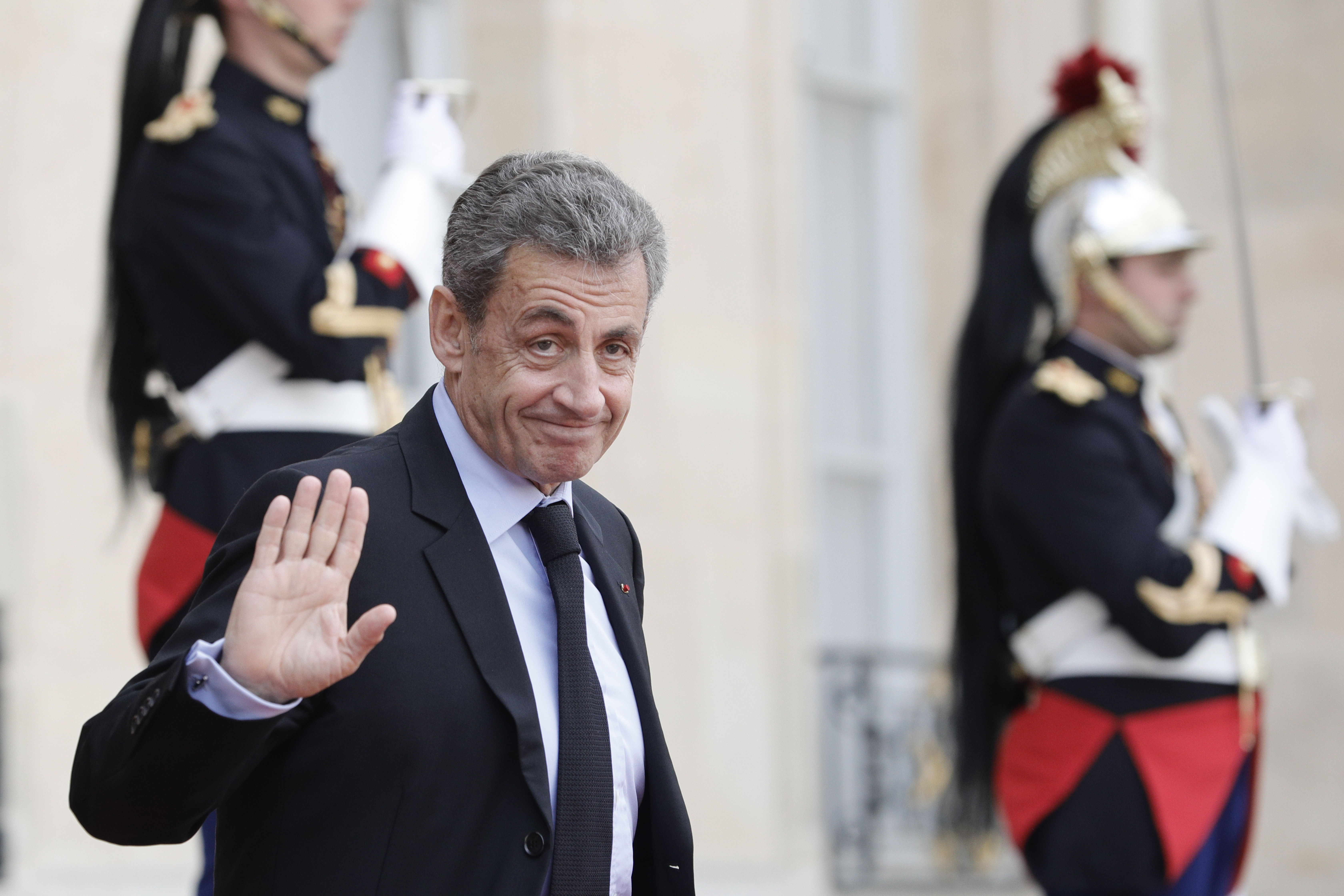 FILE - Former French President Nicolas Sarkozy leaves the Elysee Palace after a lunch with heads of states and officials, Monday, Sept. 30, 2019 in Paris. (AP Photo/Kamil Zihnioglu, File)