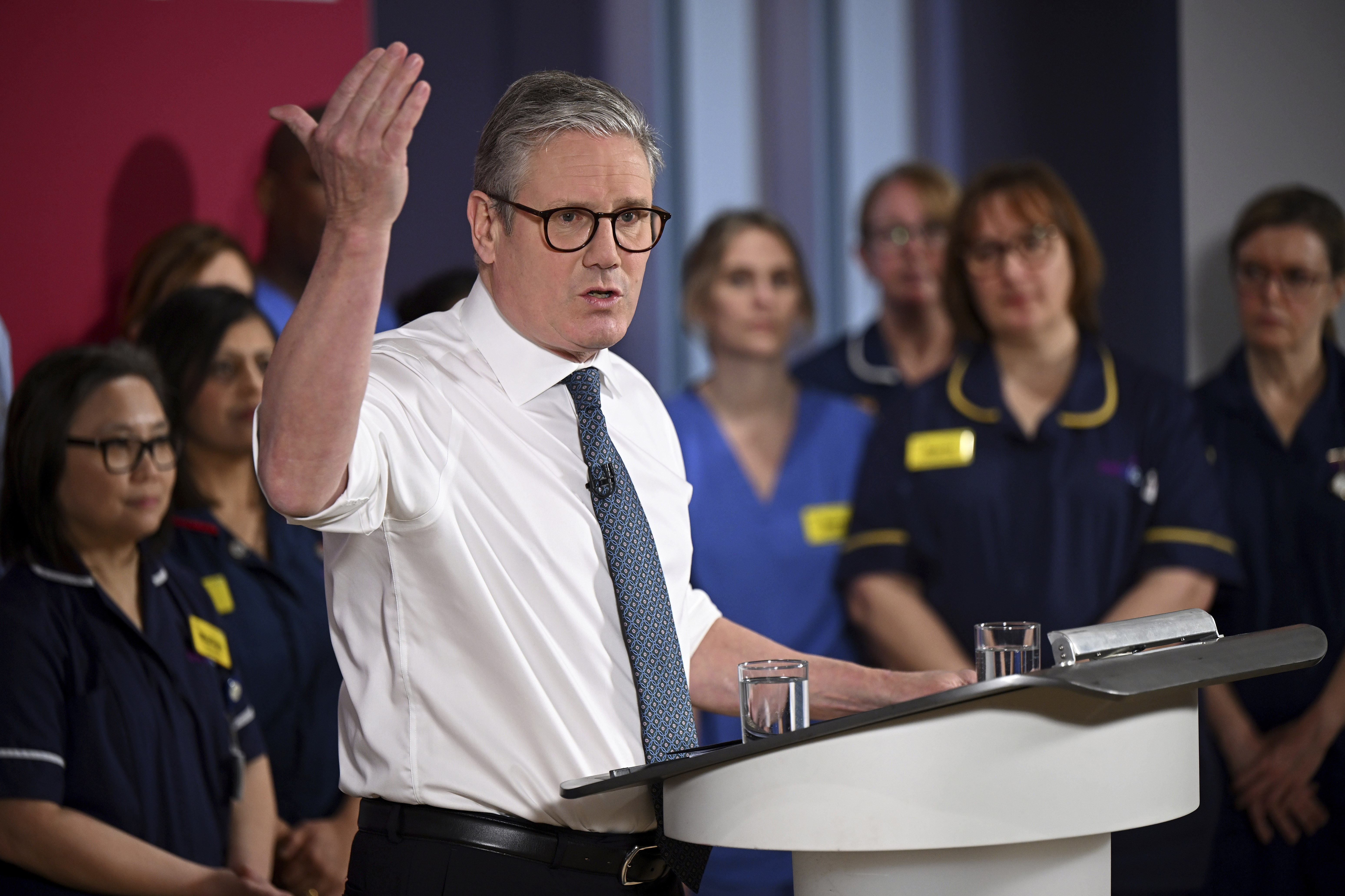 Britain's Prime Minister Keir Starmer gives a speech on reducing NHS wait times as he visits a healthcare provider in Surrey, England, Monday, Jan. 6, 2025, (Leon Neal/Pool Photo via AP)