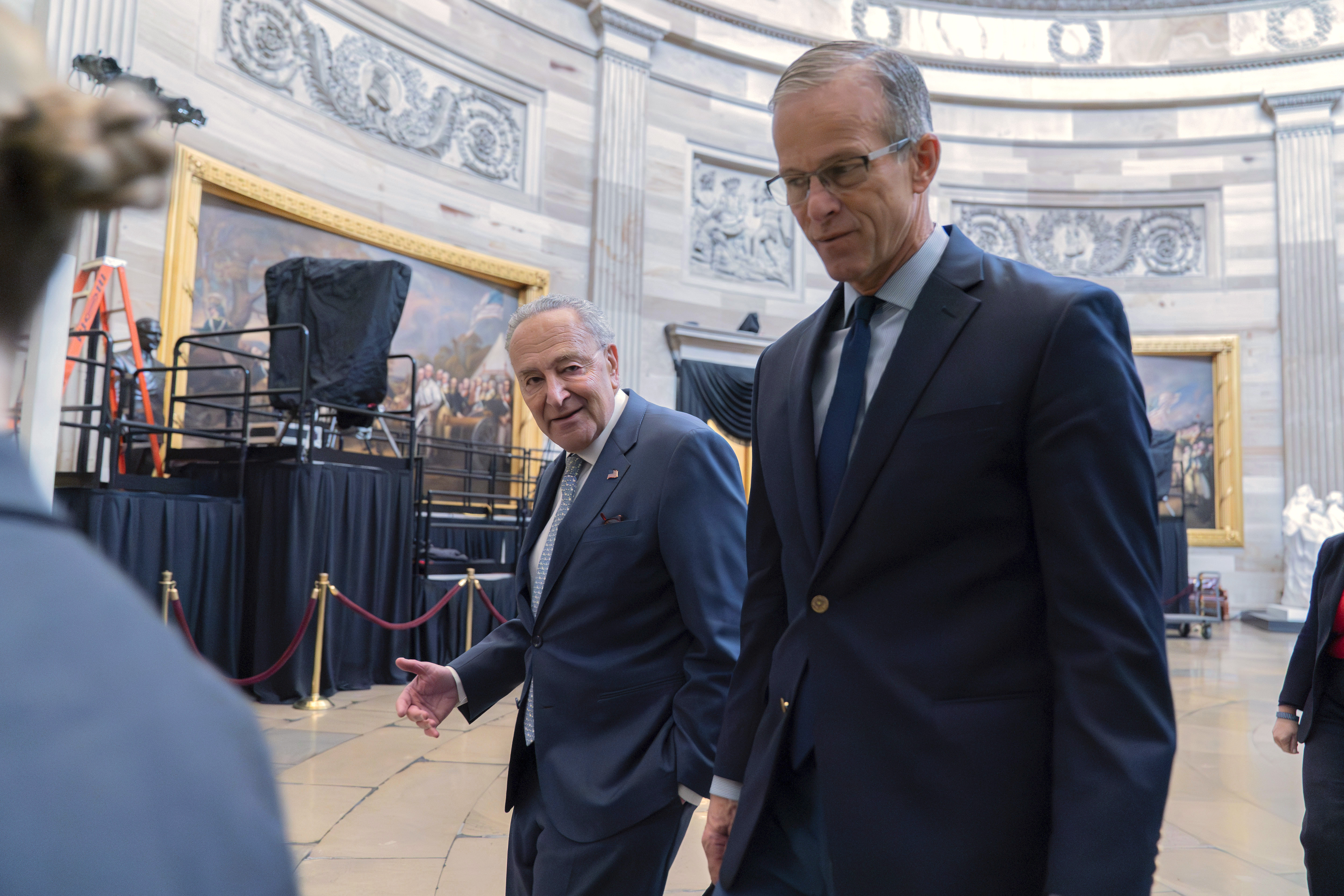 Senate Minority Leader Chuck Schumer, D-N.Y., left, and Senate Majority Leader John Thune, R-S.D., leads a Senate procession through the Rotunda to the House Chamber for a joint session of congress to confirm the Electoral College votes, at the Capitol on Monday, Jan. 6, 2025, in Washington. Walking behind her is Sen. Chuck Grassley R-Iowa. (AP Photo/Jose Luis Magana)