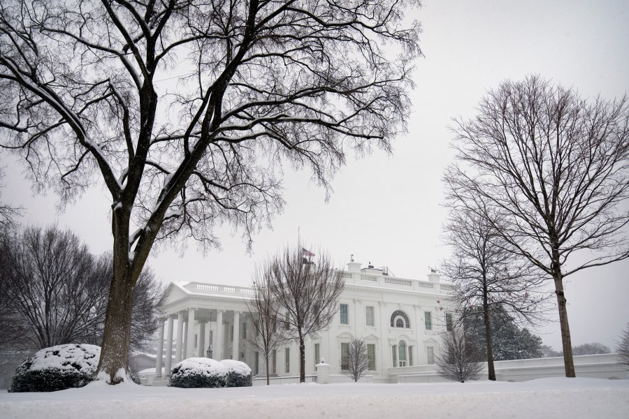 Snow falls during a winter storm at the White House, Monday, Jan. 6, 2025, in Washington. (AP Photo/Mark Schiefelbein)