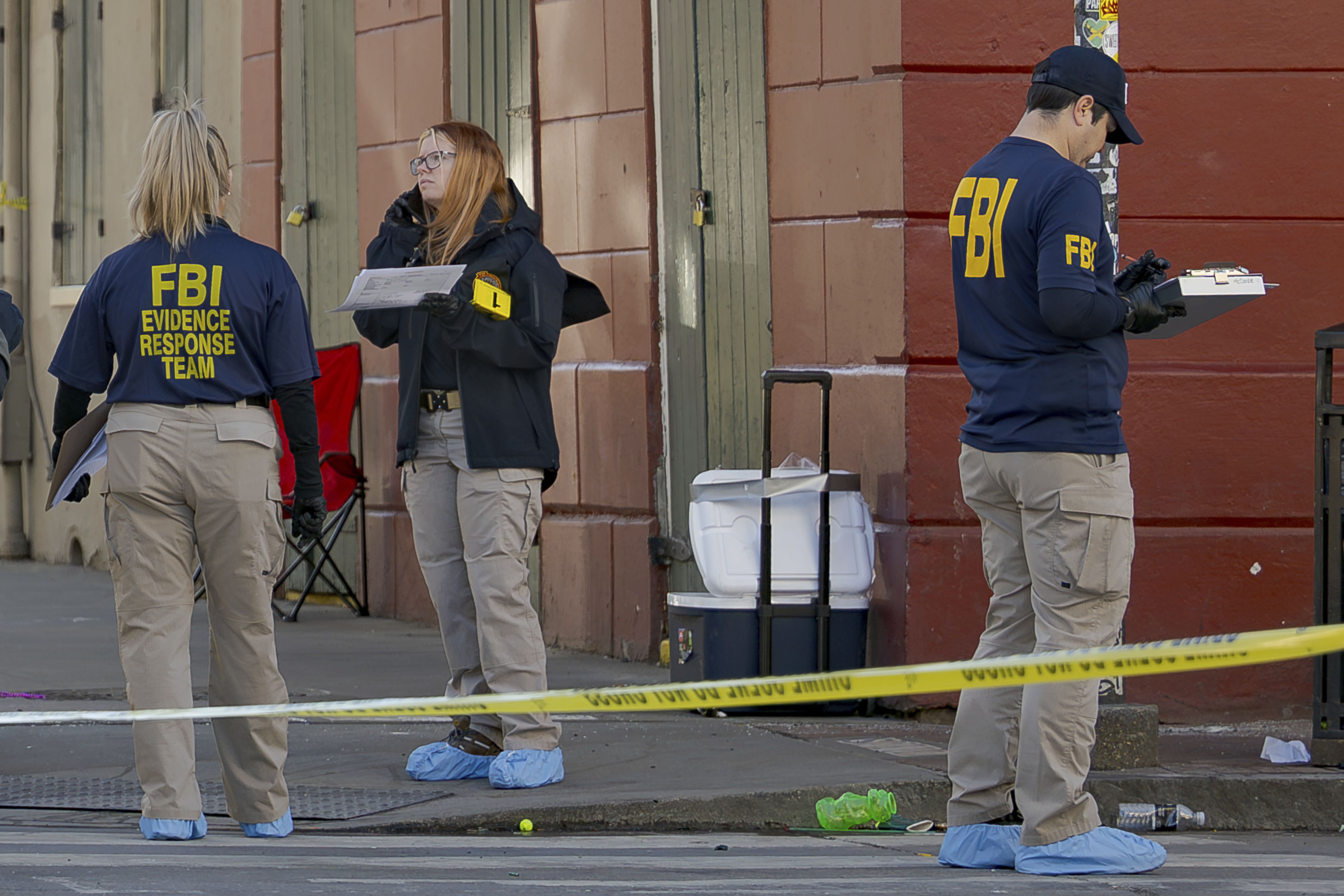 The FBI and a bomb squad earlier detonated a suspicious package found in this cooler at Bourbon St and Orleans Street in the French Quarter during the investigation of truck crashing into pedestrians followed by shooting on Bourbon Street in the French Quarter in New Orleans, Wednesday, Jan. 1, 2025. (AP Photo/Matthew Hinton)