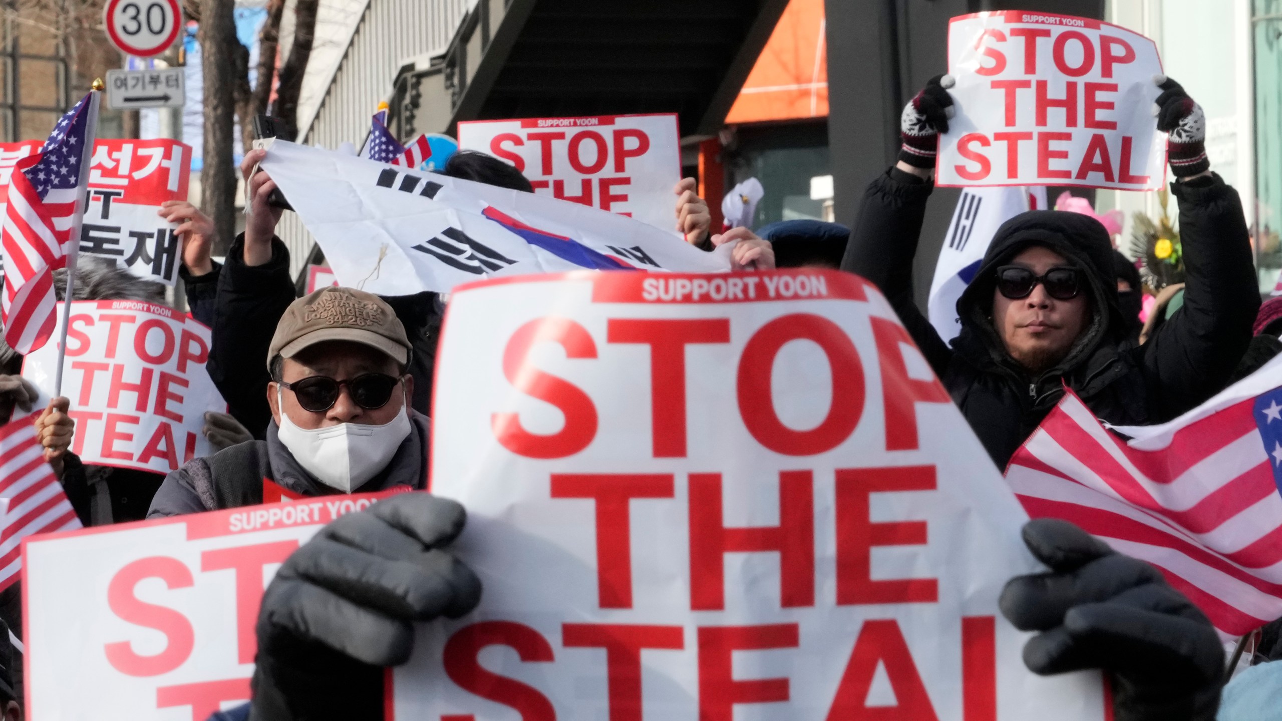 Supporters of impeached South Korean President Yoon Suk Yeol attend a rally to oppose his impeachment near the presidential residence in Seoul, South Korea, Tuesday, Jan. 7, 2025. (AP Photo/Ahn Young-joon)