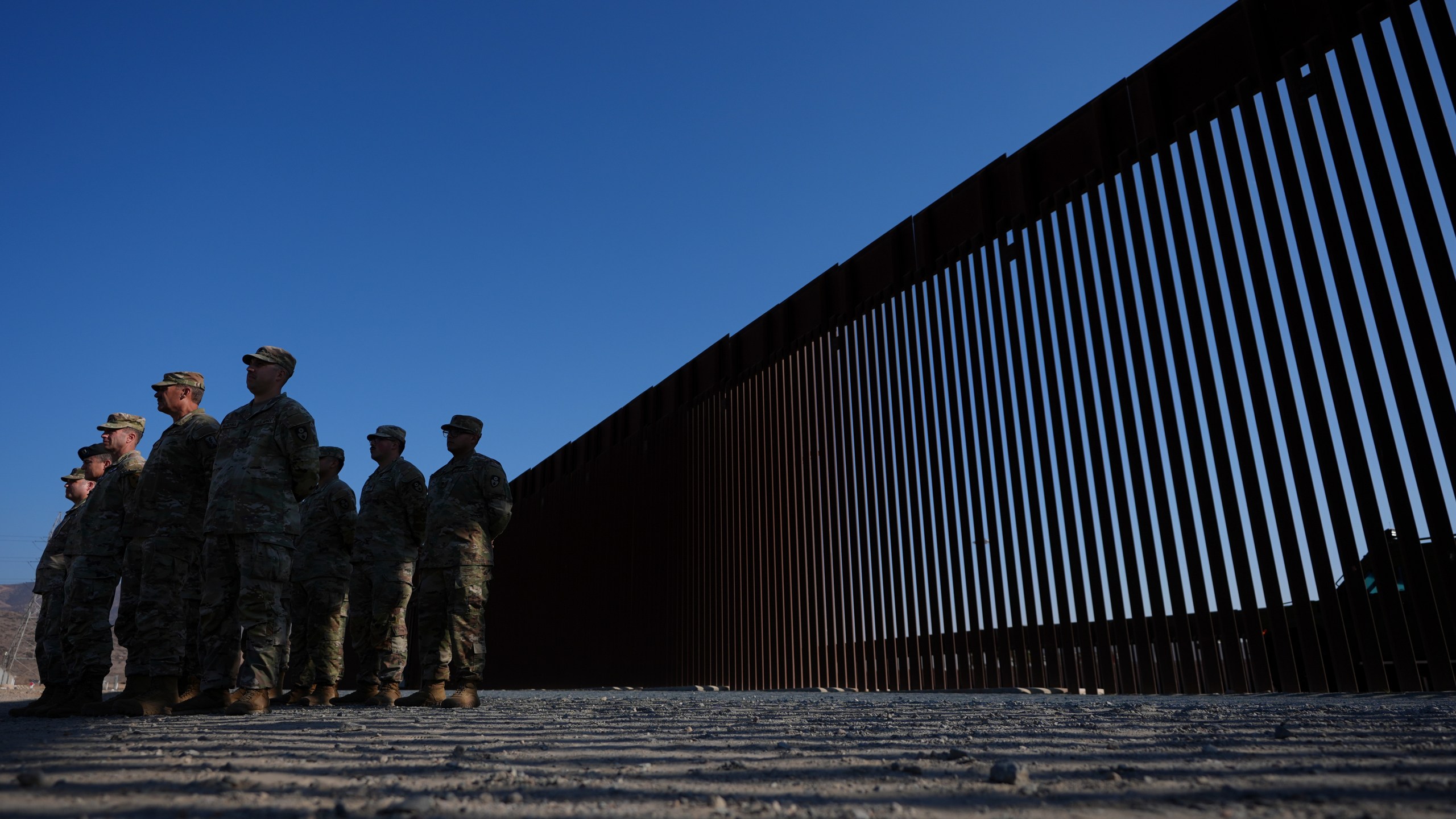 FILE - Members of the California National Guard listne during a news conference near the Otay Mesa Port of Entry along the border with Mexico, Dec. 5, 2024, in San Diego. (AP Photo/Gregory Bull, File)