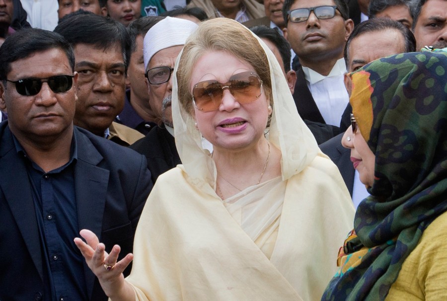 FILE- Bangladesh's former prime minister and Bangladesh Nationalist Party (BNP) chairperson Khaleda Zia, center, leaves after a court appearance in Dhaka, Bangladesh, Dec. 28, 2017. (AP Photo/A.M. Ahad, File)