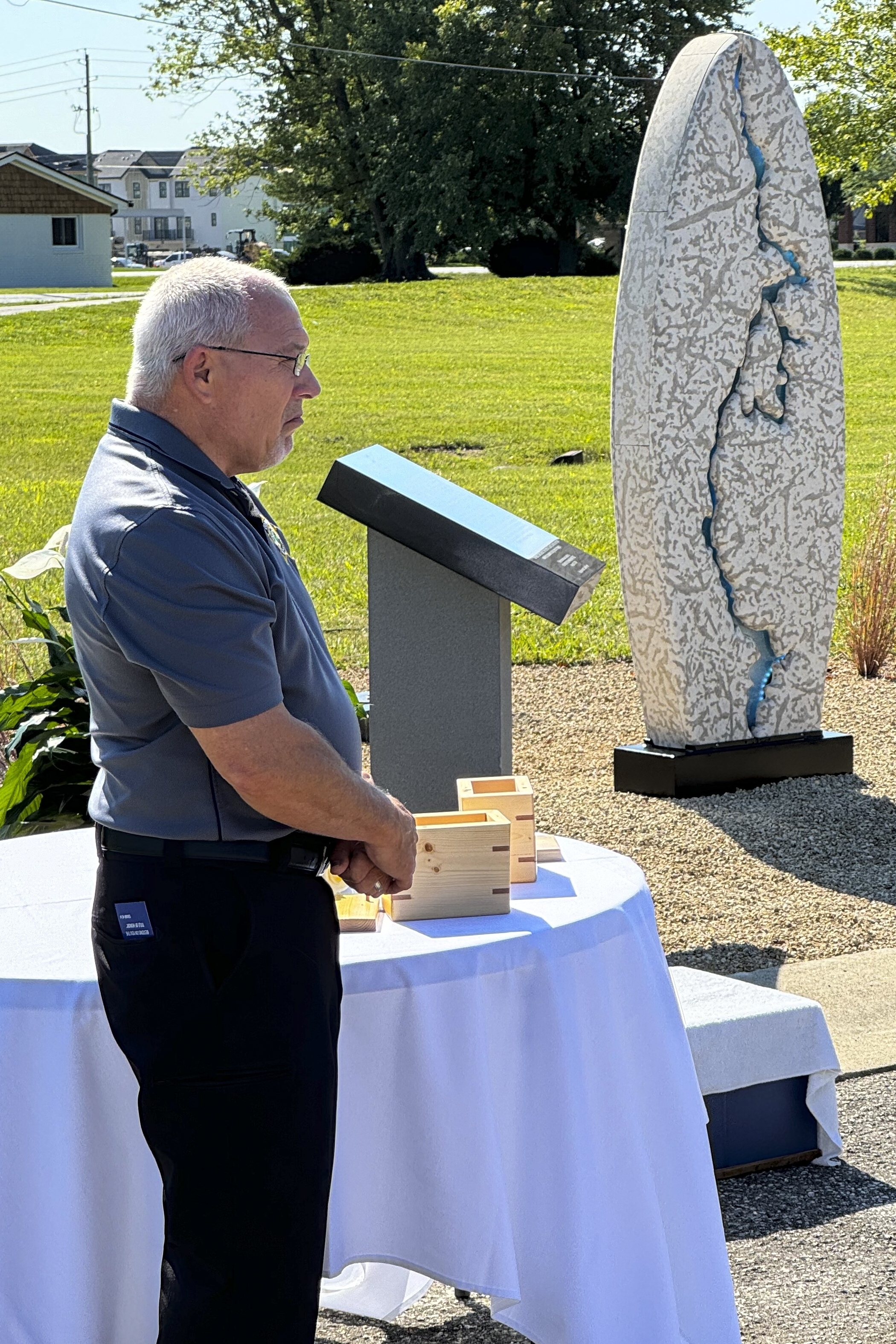 Hamilton County Coroner Jeff Jellison stands on August 29, 2024, in Westfield, Indiana, during the dedication of a memorial honoring suspected serial killer Herbert Baumeister's nine known victims. (AP Photo/Rick Callahan)