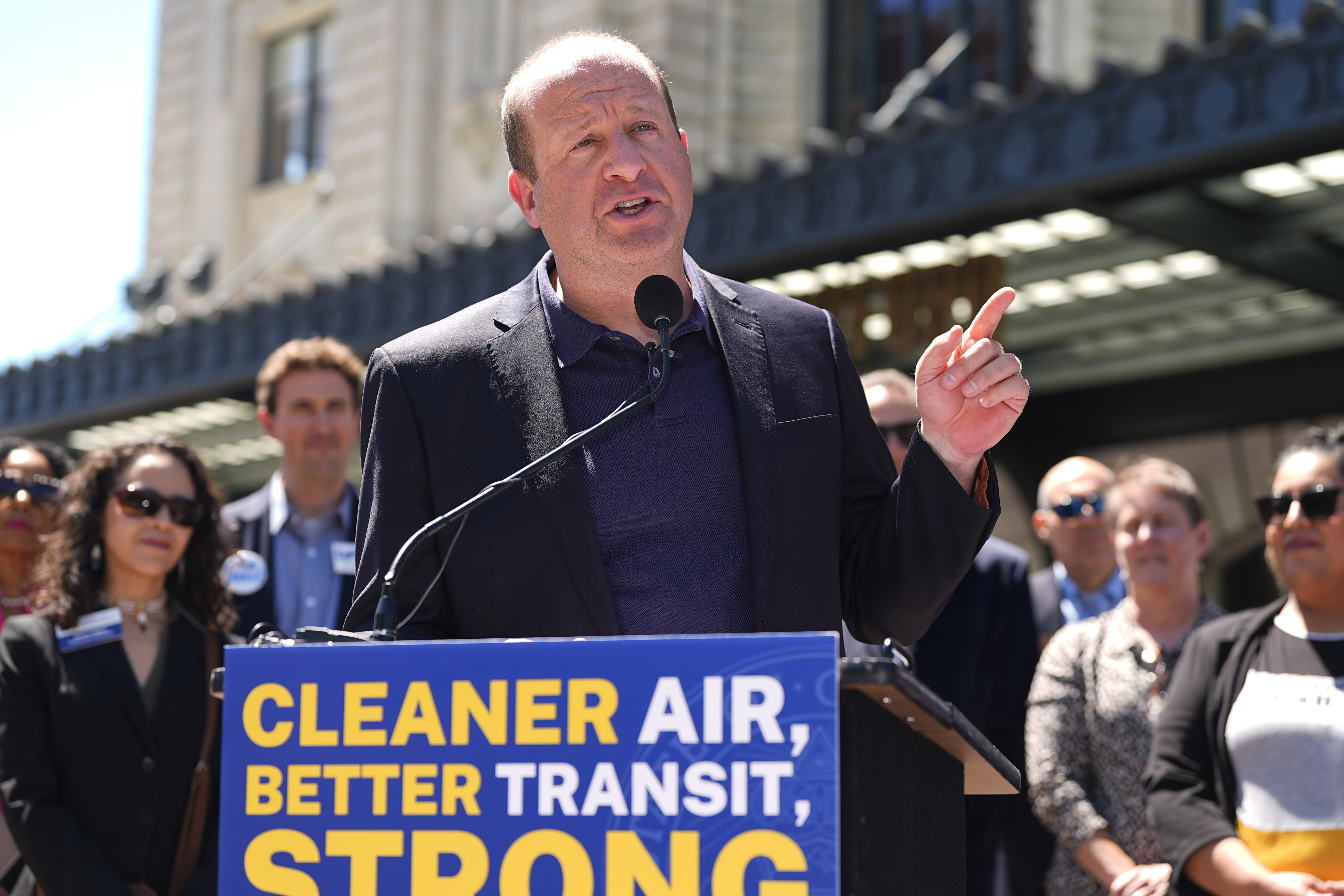 FILE - Colorado Gov. Jared Polis speaks before signing into law a surface transportation infrastructure development bill to help connect the state with a passenger rail system during a ceremony May 16, 2024, in front of Union Station in lower downtown Denver. (AP Photo/David Zalubowski, File)