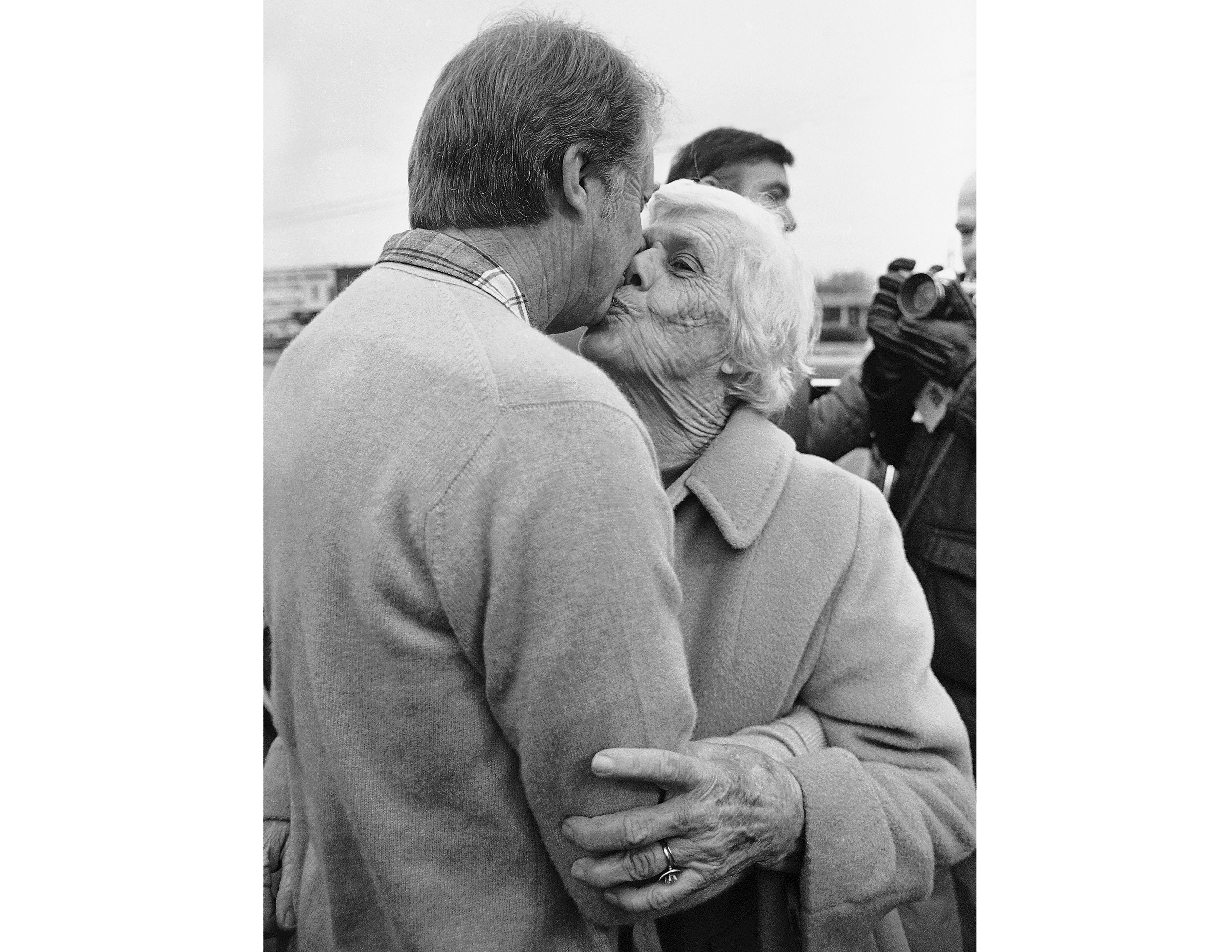 FILE - President-elect Jimmy Carter gets a kiss from his mother, Lillian Carter, on Dec. 6, 1976, in Plains, Ga. (AP Photo/File)