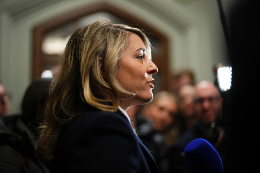 Foreign Affairs Minister Melanie July arrives for a Liberal caucus meeting in Ottawa on Wednesday, Jan. 8, 2025. (Sean Kilpatrick/The Canadian Press via AP)