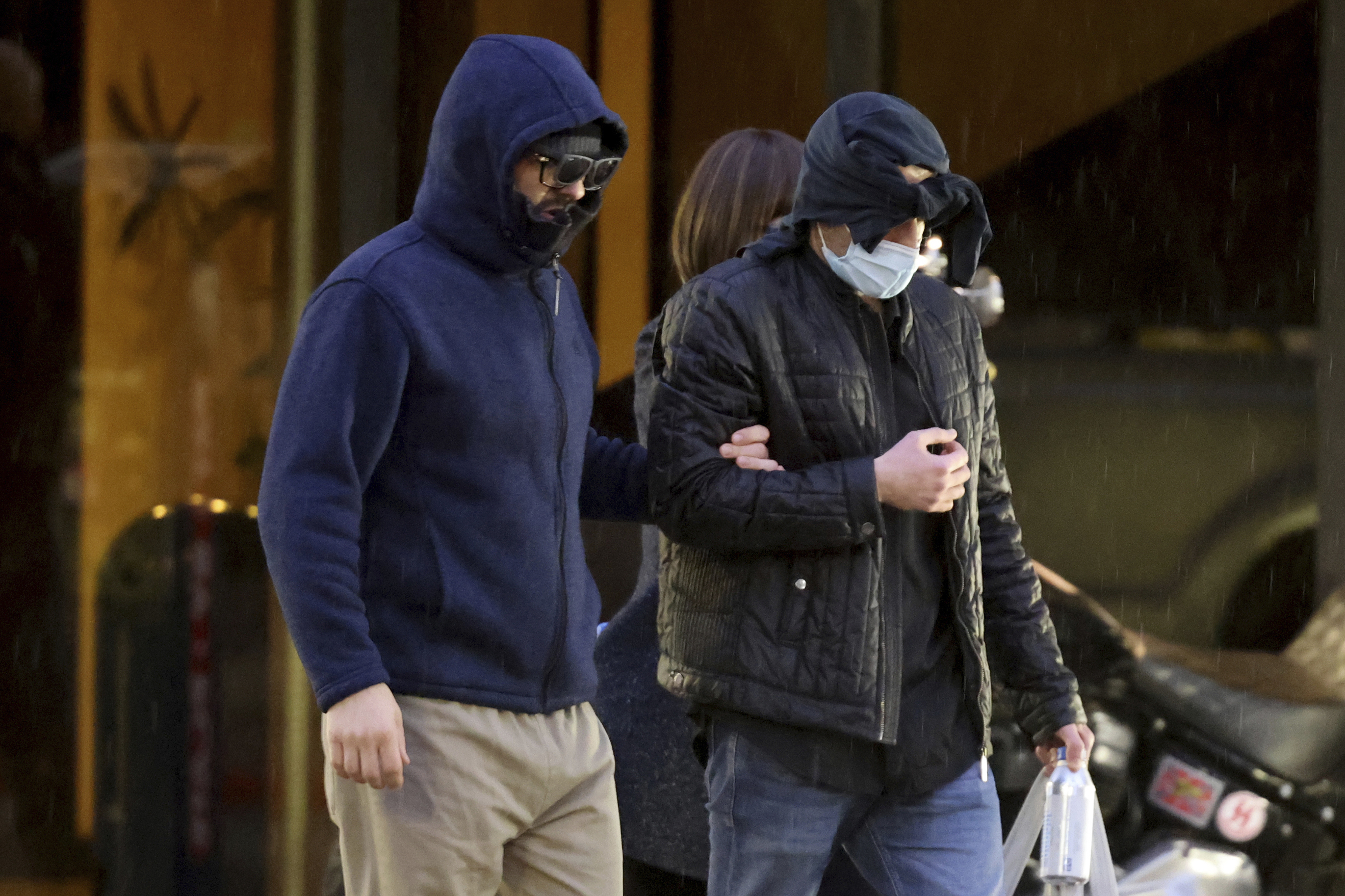 FILE - Former FBI informant Alexander Smirnov, left, walks out of his lawyer's office in downtown Las Vegas after being released from federal custody Feb. 20, 2024. (K.M. Cannon/Las Vegas Review-Journal via AP, File)