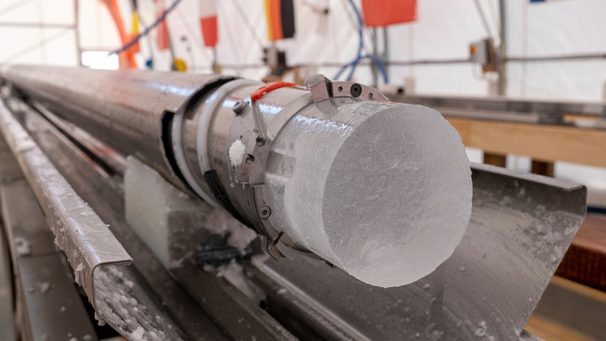 An ice core drilled by a research team is displayed at Little Dome C field base in eastern Antarctica, during the cutting phase on Tuesday, Jan. 7, 2025. (PNRA/IPEV Beyond Epica via AP)