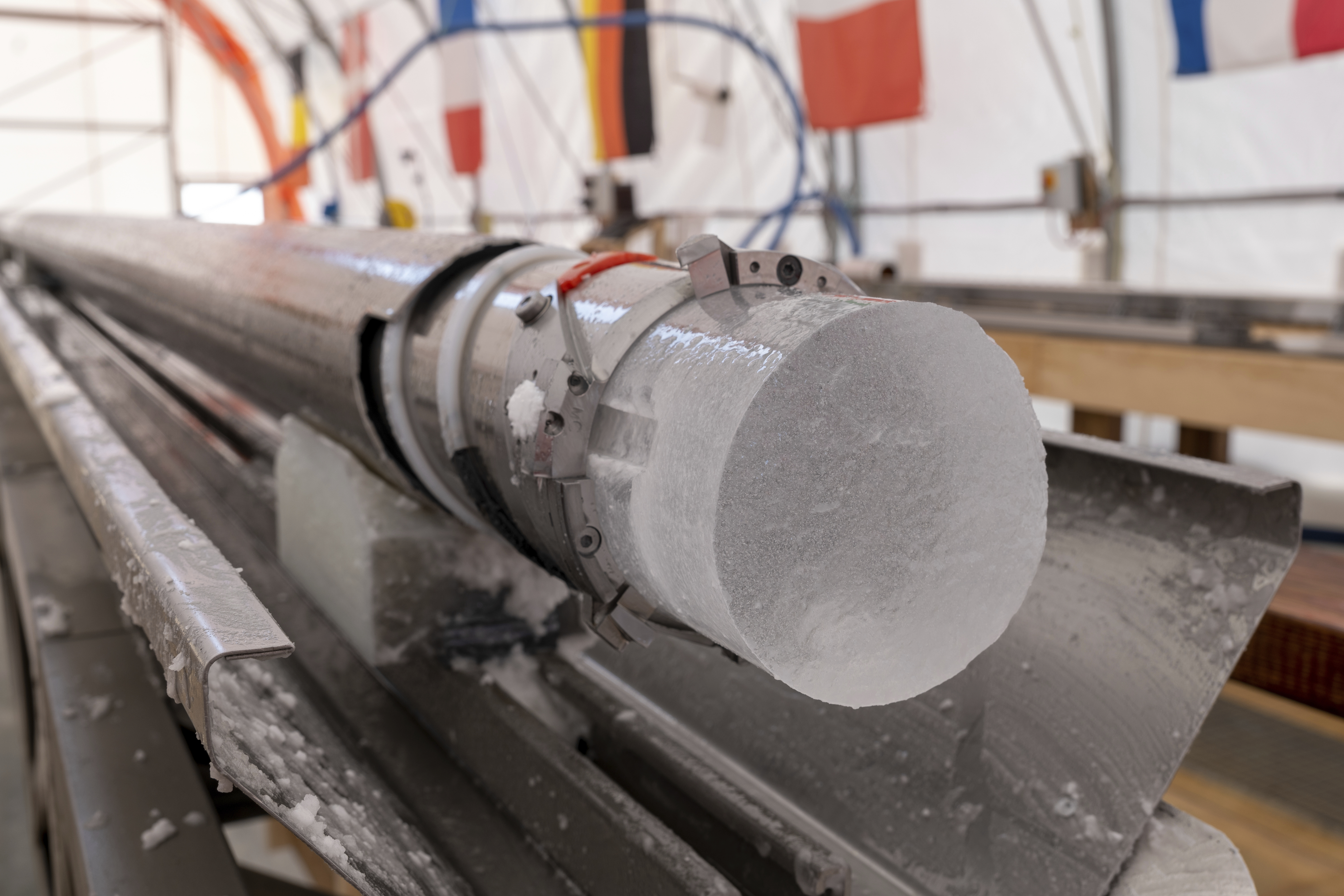 An ice core drilled by a research team is displayed at Little Dome C field base in eastern Antarctica, during the cutting phase on Tuesday, Jan. 7, 2025. (PNRA/IPEV Beyond Epica via AP)