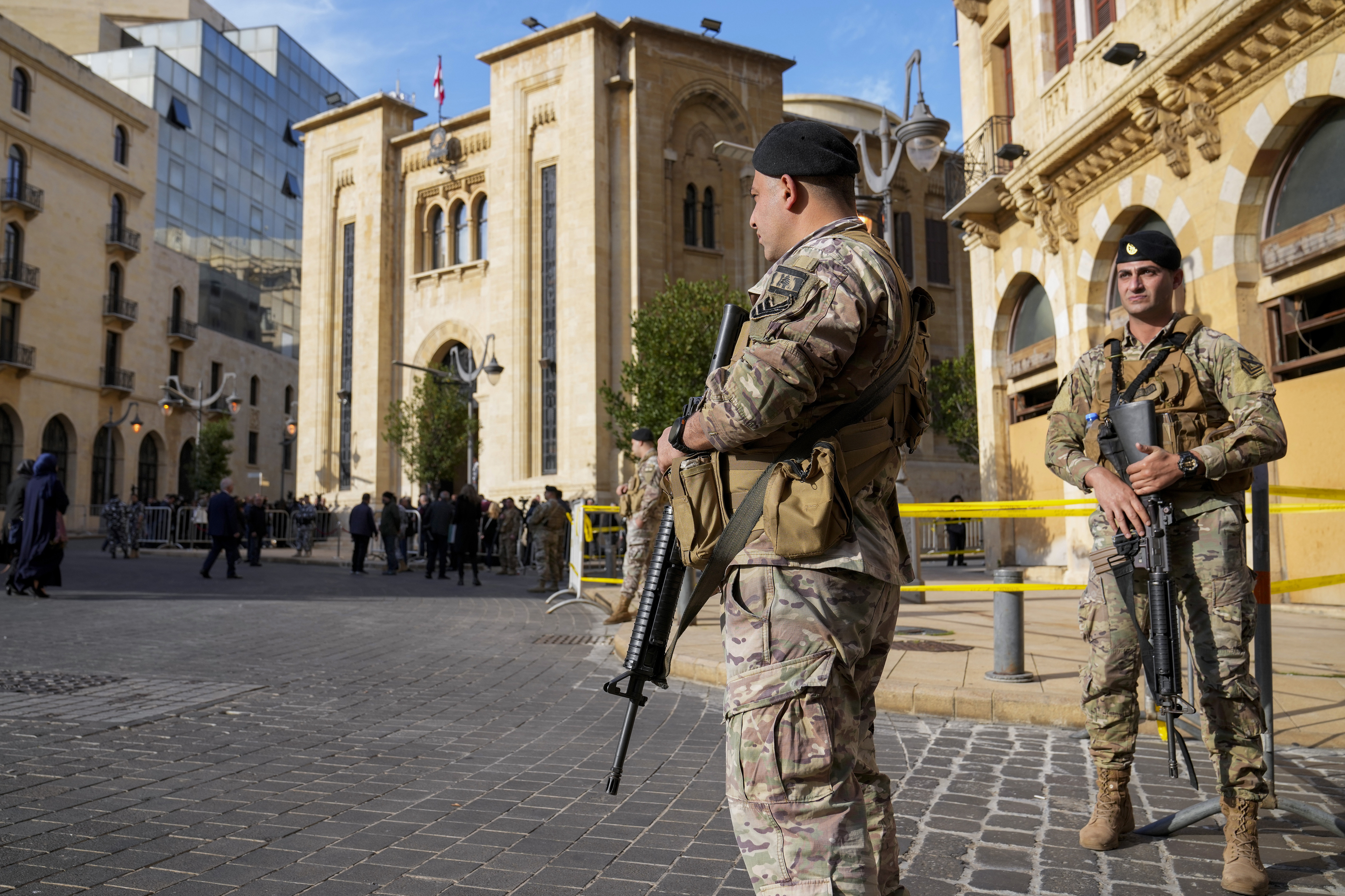 Lebanese army soldiers stand guard in front of the parliament building before a session to elect a new Lebanese president in down town Beirut, Lebanon, Thursday, Jan. 9, 2025. (AP Photo/Hussein Malla)