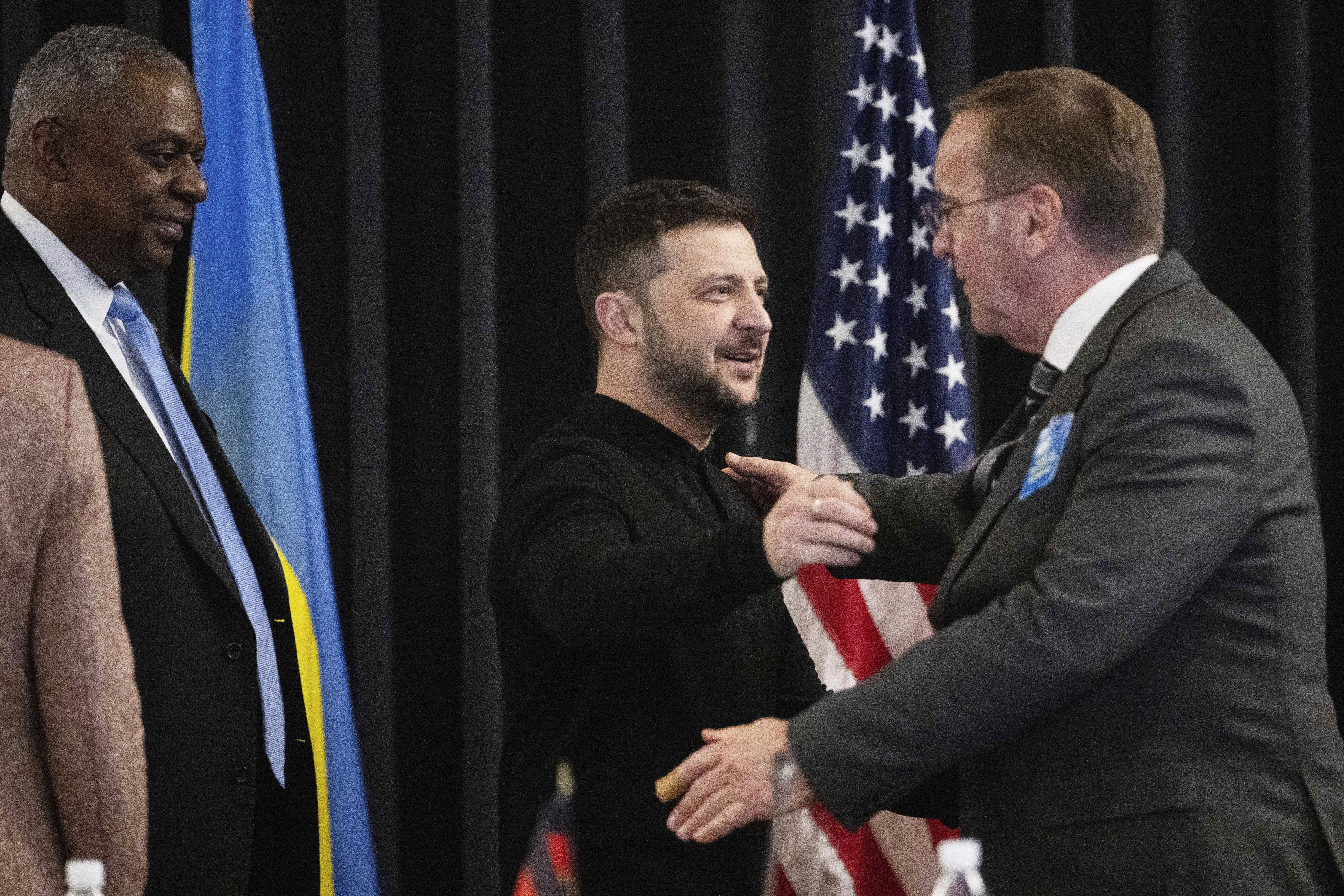 From left: U.S. Secretary of Defense Lloyd Austin, Ukrainian President Volodymyr Zelenskyy and German Defence Minister Boris Pistorius attend a meeting of the Ukraine Contact Group at Ramstein Air Base, Germany, Thursday, Jan. 9, 2025. (Marijan Murat/dpa via AP)