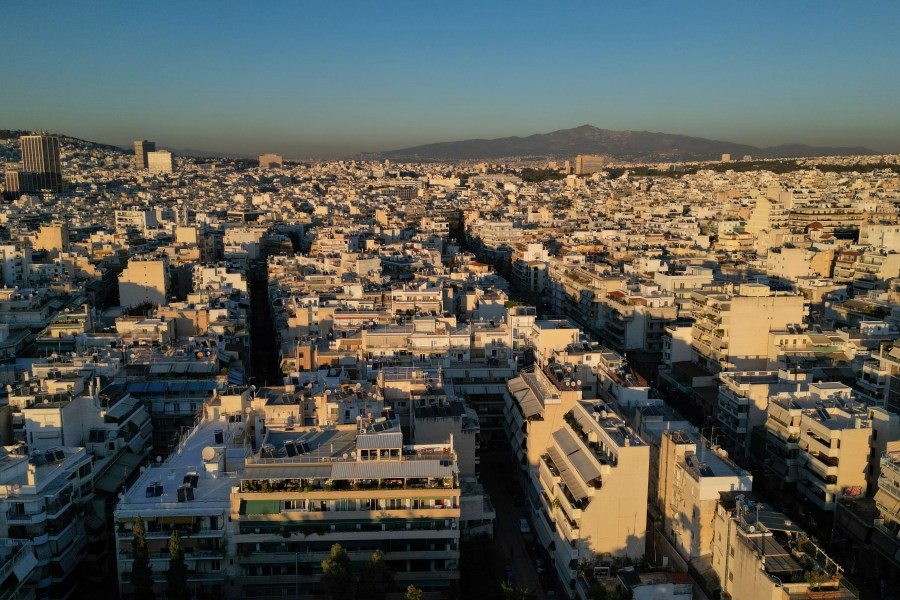 FILE - An aerial photograph taken by a drone shows buildings in Athens, Greece, Tuesday, Dec. 17, 2024. (AP Photo/Thanassis Stavrakis, File)