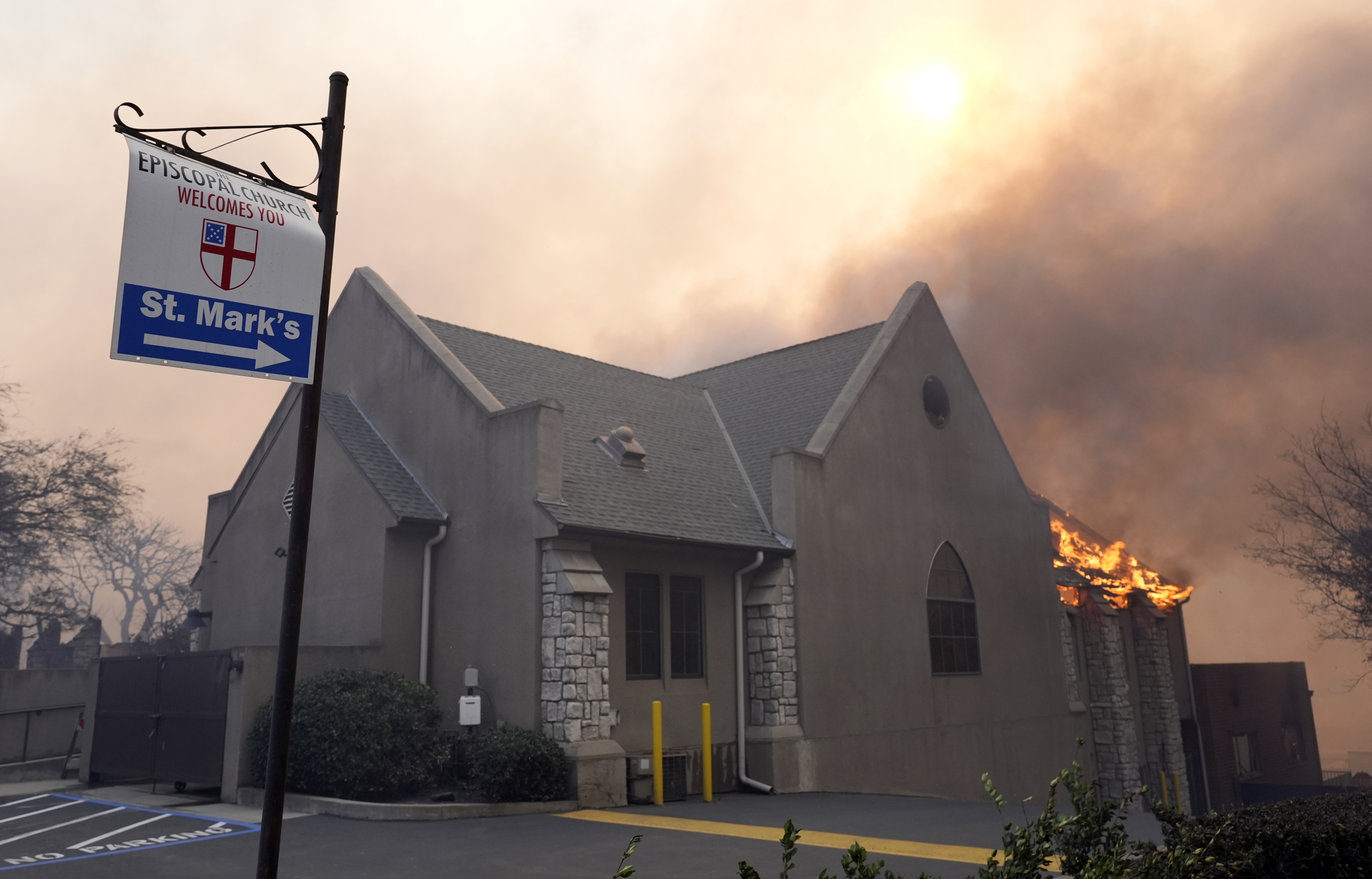 Flames rise out of St. Mark's Episcopal Church, Wednesday, Jan. 8, 2025, in the downtown Altadena section of Pasadena, Calif. (AP Photo/Chris Pizzello)