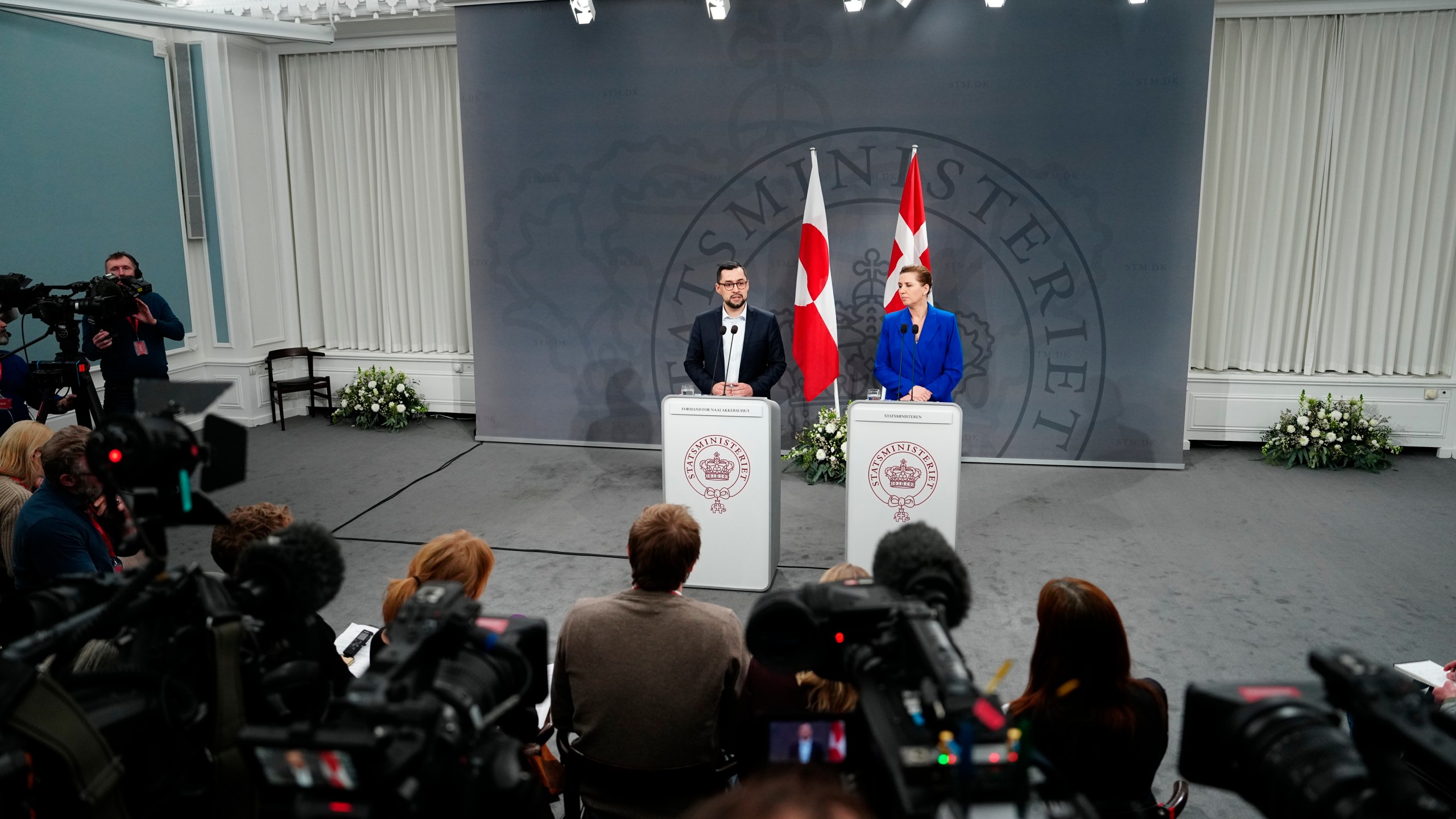 Danish Prime Minister Mette Frederiksen and her Greenland's counterpart Mute B. Egede, left, meet the media in the Mirror Hall at the Prime Minister's Office, at Christiansborg in Copenhagen, Friday, Jan. 10, 2025. (Mads Claus Rasmussen/Ritzau Scanpix via AP)