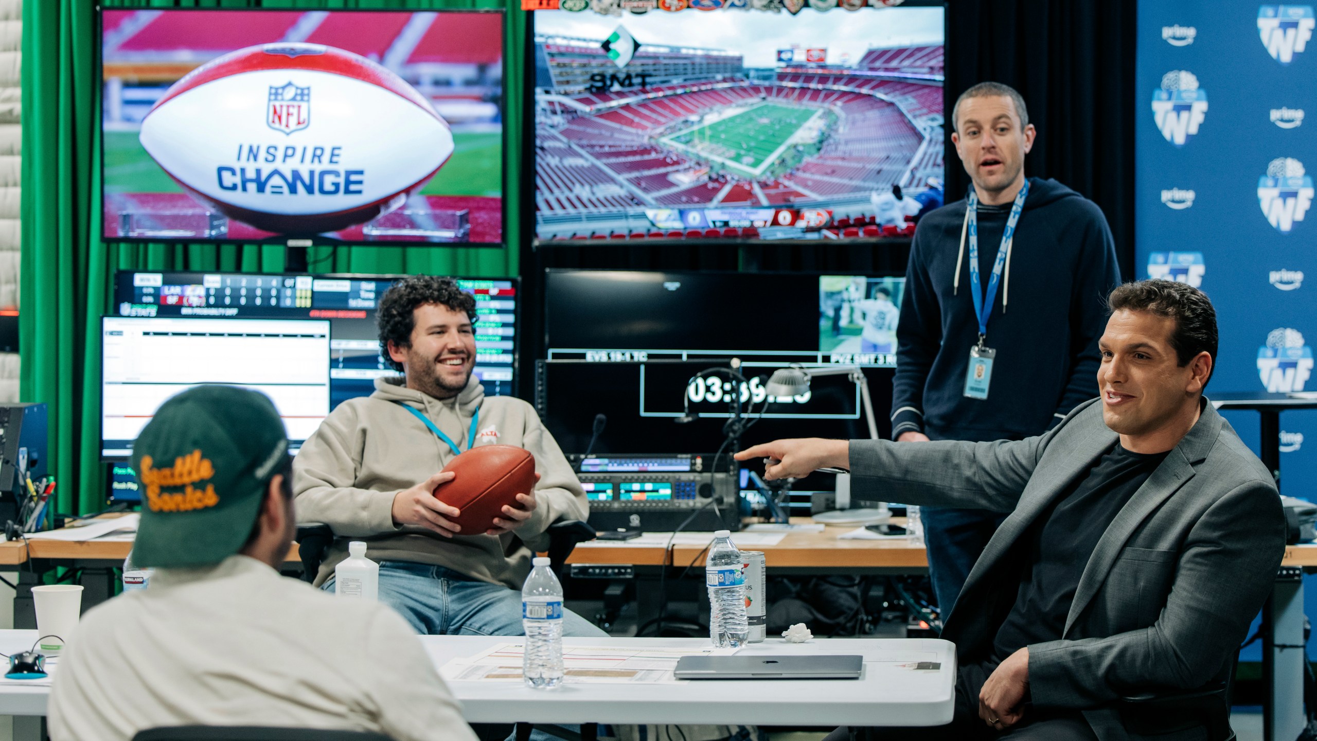 IN this image provided by Amazon Prime Video, from left, Prime Video Senior Coordinating Producer Alex Strand; Keegan Abdoo of the NFL’s Next Gen Stats Department; Scott Karpen, Producer of “Prime Vision with Next Gen Stats”; and Prime Video “Thursday Night Football” analytics expert Sam Schwartzstein talk at the Amazon/MGM Studios in Culver City, Calif., Thursday, Dec 12, 2024, , before the Los Angeles Rams-San Francisco 49ers NFL football game. (Timothy Buckman/Amazon Prime Video via AP)