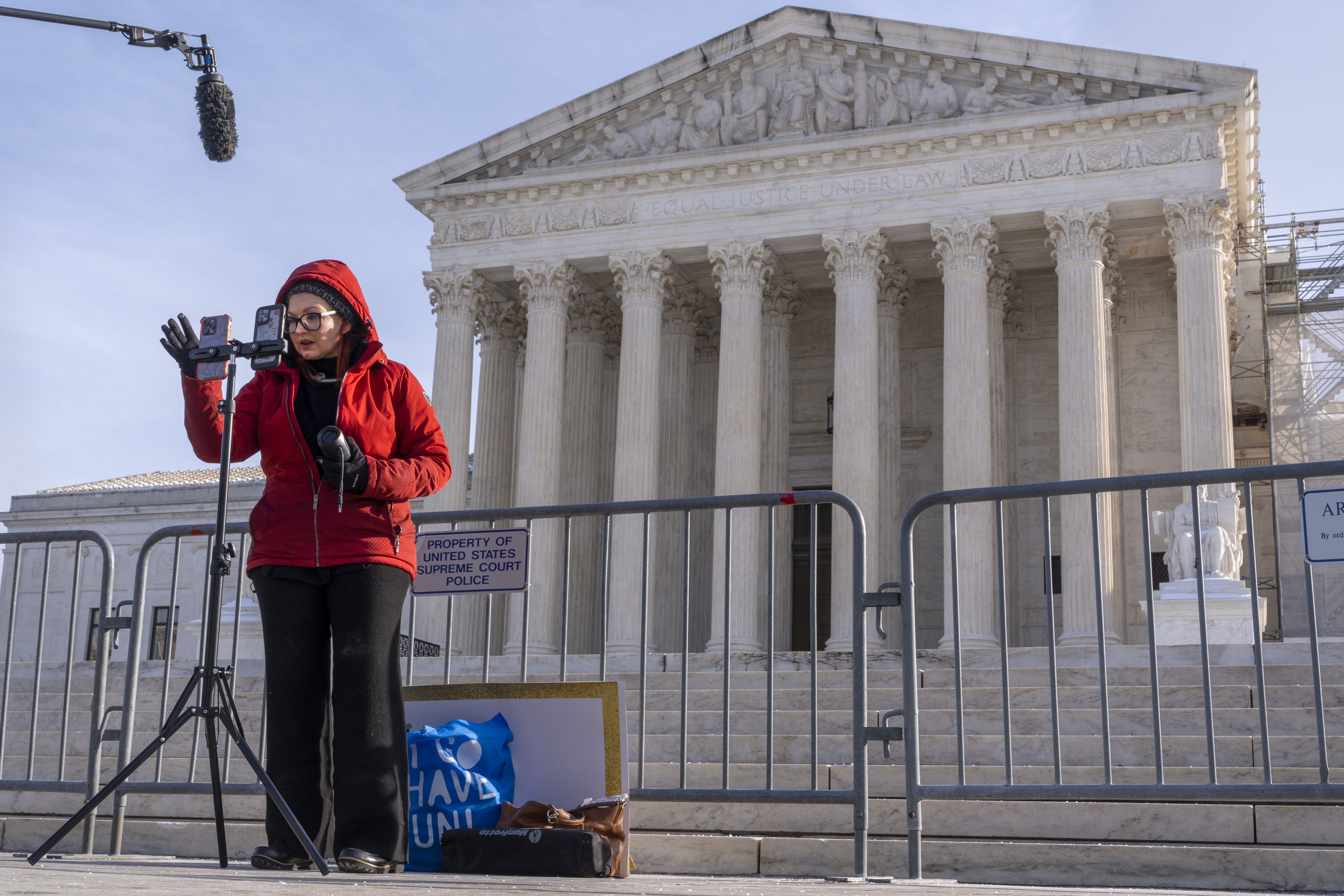 Tiffany Cianci, who says she is a "long form educational content creator," livestreams to TikTok, outside the Supreme Court, Friday, Jan. 10, 2025, in Washington. (AP Photo/Jacquelyn Martin)