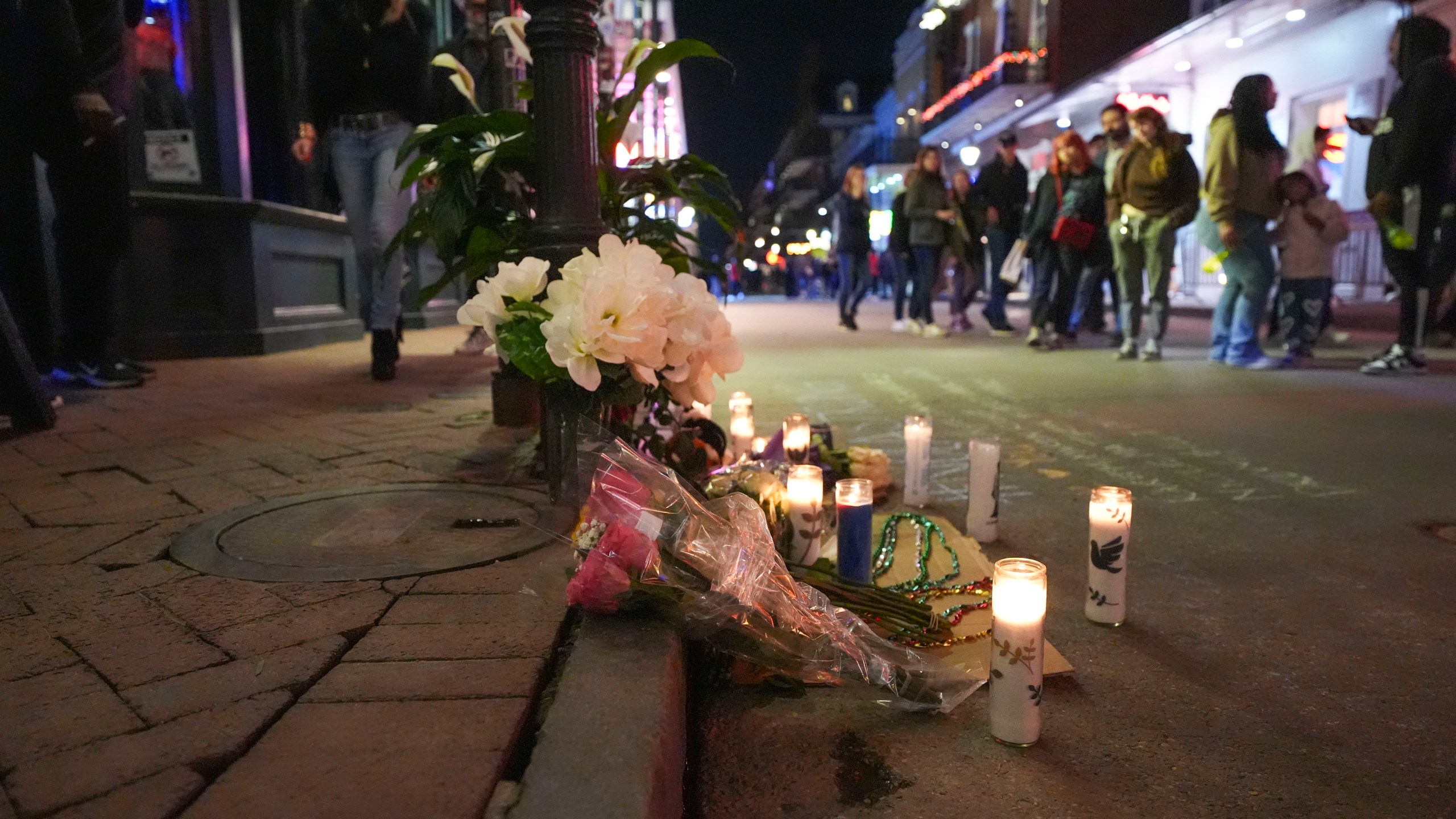 A memorial on Bourbon Street sits at the site of a deadly truck attack on New Year's Day in New Orleans, Friday, Jan. 3, 2025. (AP Photo/Gerald Herbert)