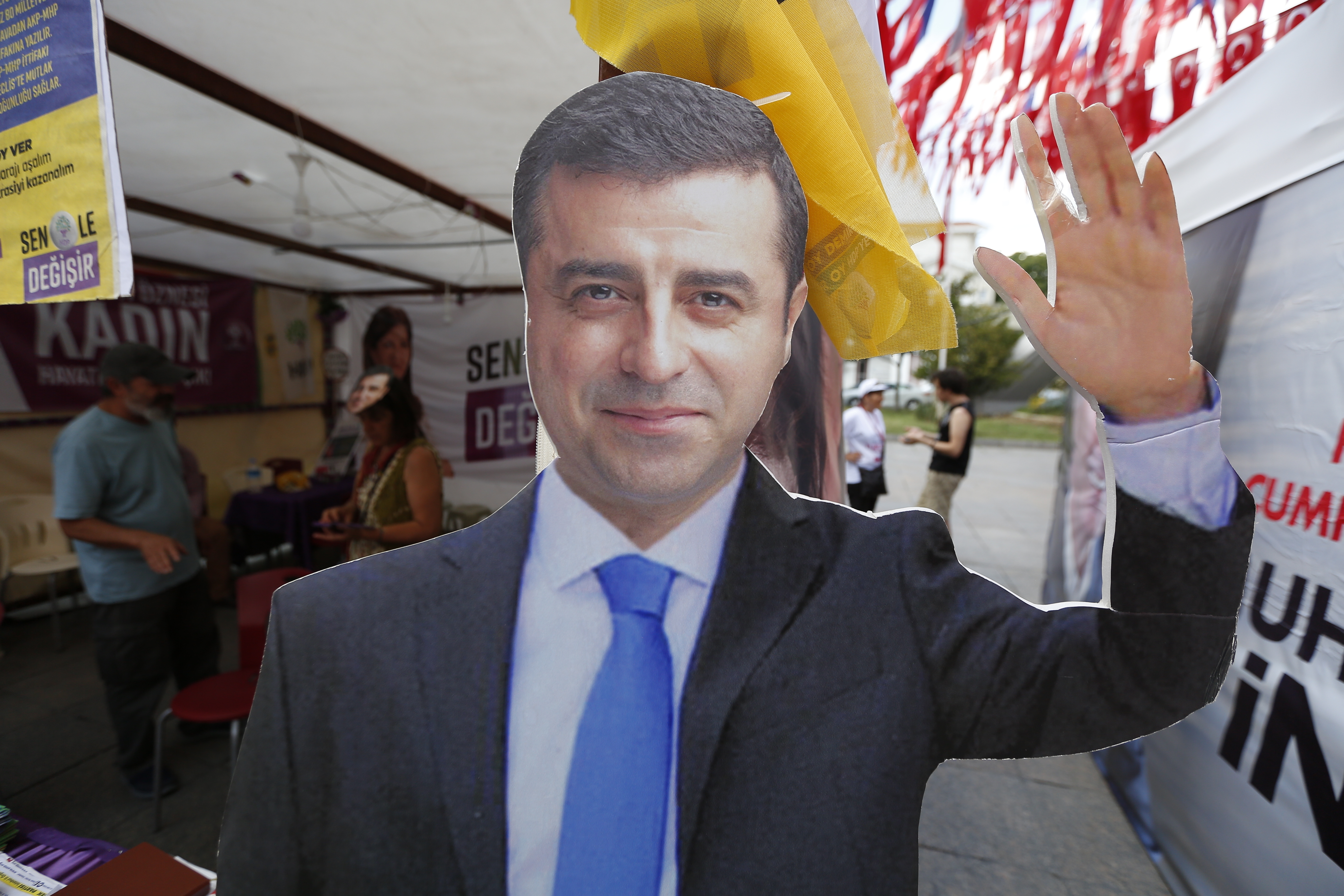 FILE - A cardboard cut-out of Selahattin Demirtas is pictured at an election kiosk in Istanbul, June 20, 2018. (AP Photo/Lefteris Pitarakis, File)