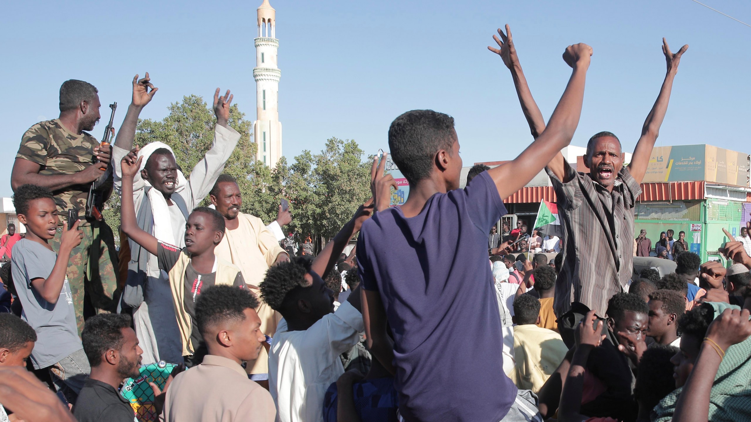 People celebrate following the reports that, Sudan's army had entered the central city of Wad Madani and pushed out its paramilitary rivals the Rapid Support Forces (RSF), in Merowe, Sudan, Saturday, Jan.11, 2025. (AP Photo/Marwan Ali)