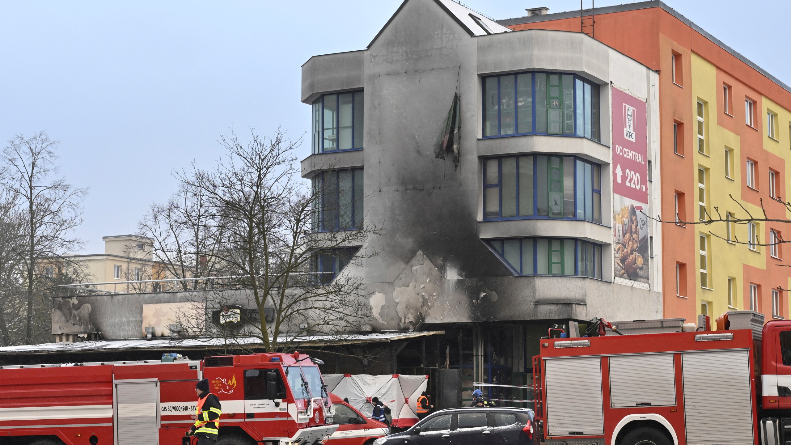 Emergency services attend the scene of a fire at a restaurant in Most, Czech Republic, Sunday Jan. 12, 2025. (Ondrej Hajek/CTK via AP)