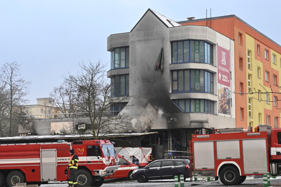 Emergency services attend the scene of a fire at a restaurant in Most, Czech Republic, Sunday Jan. 12, 2025. (Ondrej Hajek/CTK via AP)