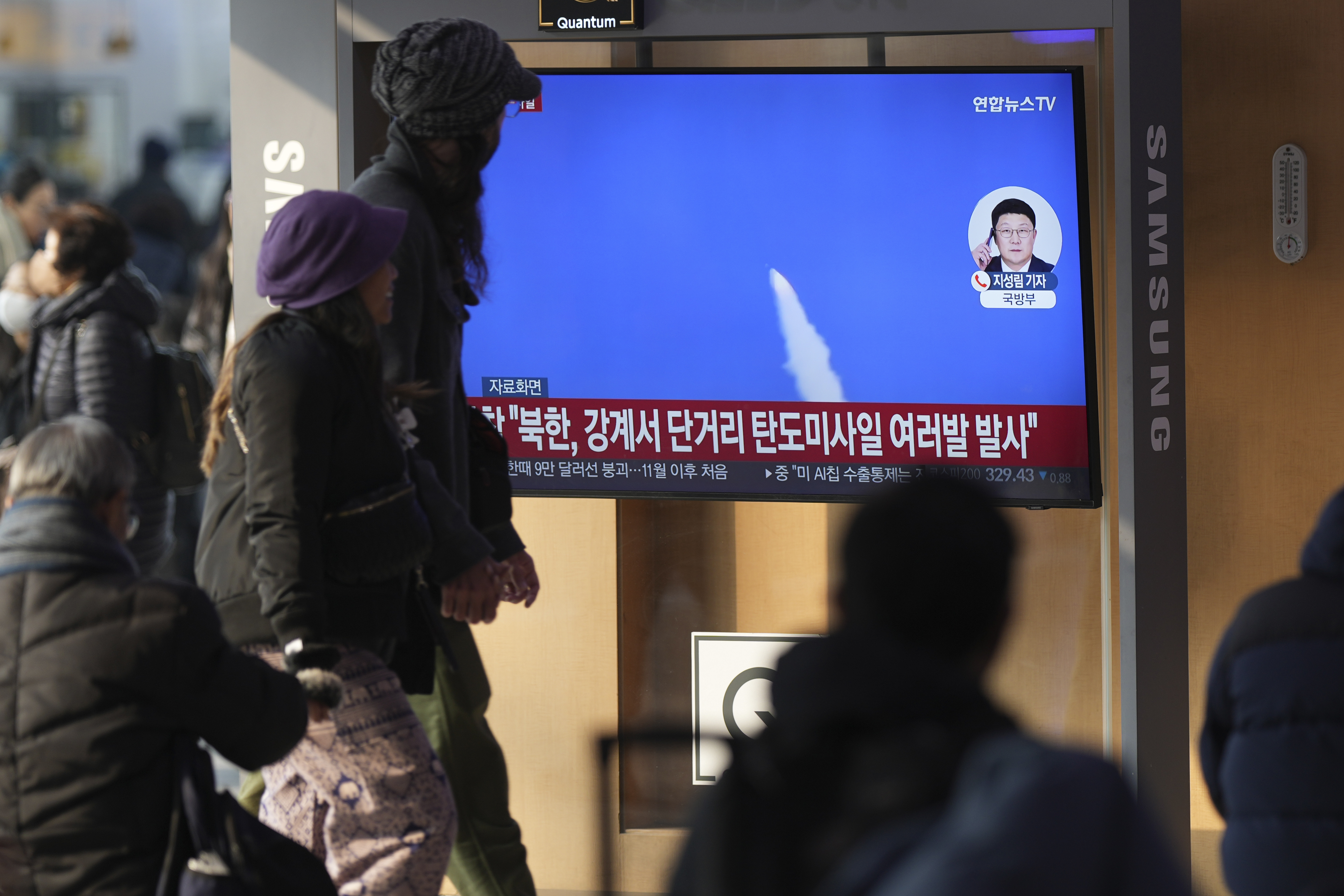 A TV screen shows a report of North Korea's missiles launch with file footage during a news program at the Seoul Railway Station in Seoul, South Korea, Tuesday, Jan. 14, 2025. (AP Photo/Lee Jin-man)