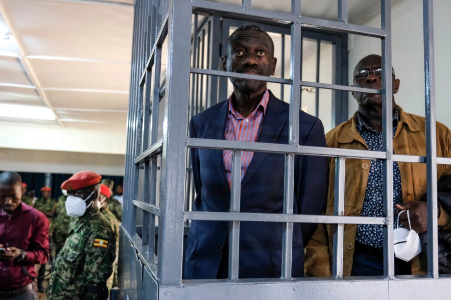 FILE - Ugandan opposition leader and four-time presidential candidate Kizza Besigye, stands in the dock at the Makindye Martial Court in Kampala, Uganda Wednesday, Nov. 20. 2024. (AP Photo/Hajarah Nalwadda)