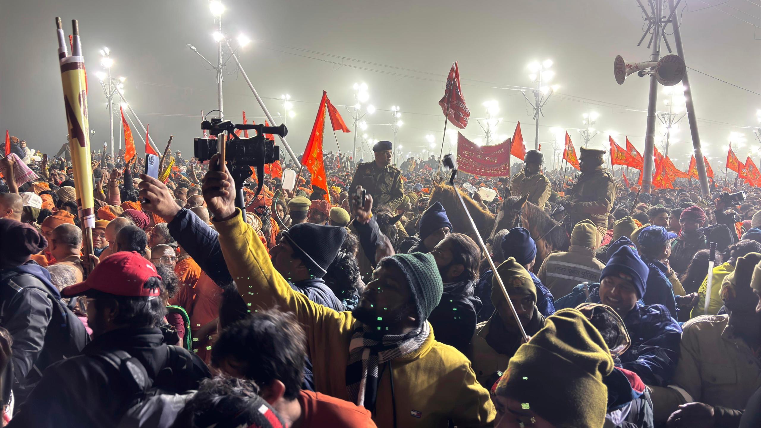 Policemen on horseback control the crowd at the confluence of the Ganges, the Yamuna and the mythical Saraswati rivers on Makar Sankranti, an auspicious bathing day of the 45-day-long Maha Kumbh festival in Prayagraj, India, Tuesday, Jan. 14, 2025. (AP Photo/Ashwini Bhatia)