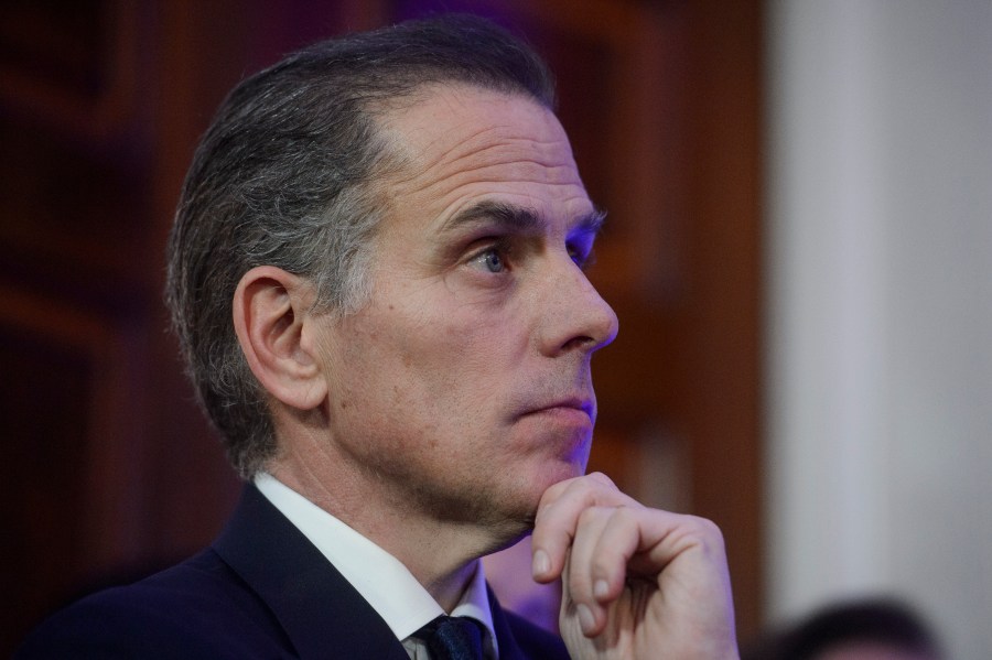 Hunter Biden listens while his father, President Joe Biden, speaks during a Hanukkah reception in the East Room of the White House in Washington, Monday, Dec. 16, 2024. (AP Photo/Rod Lamkey, Jr.)