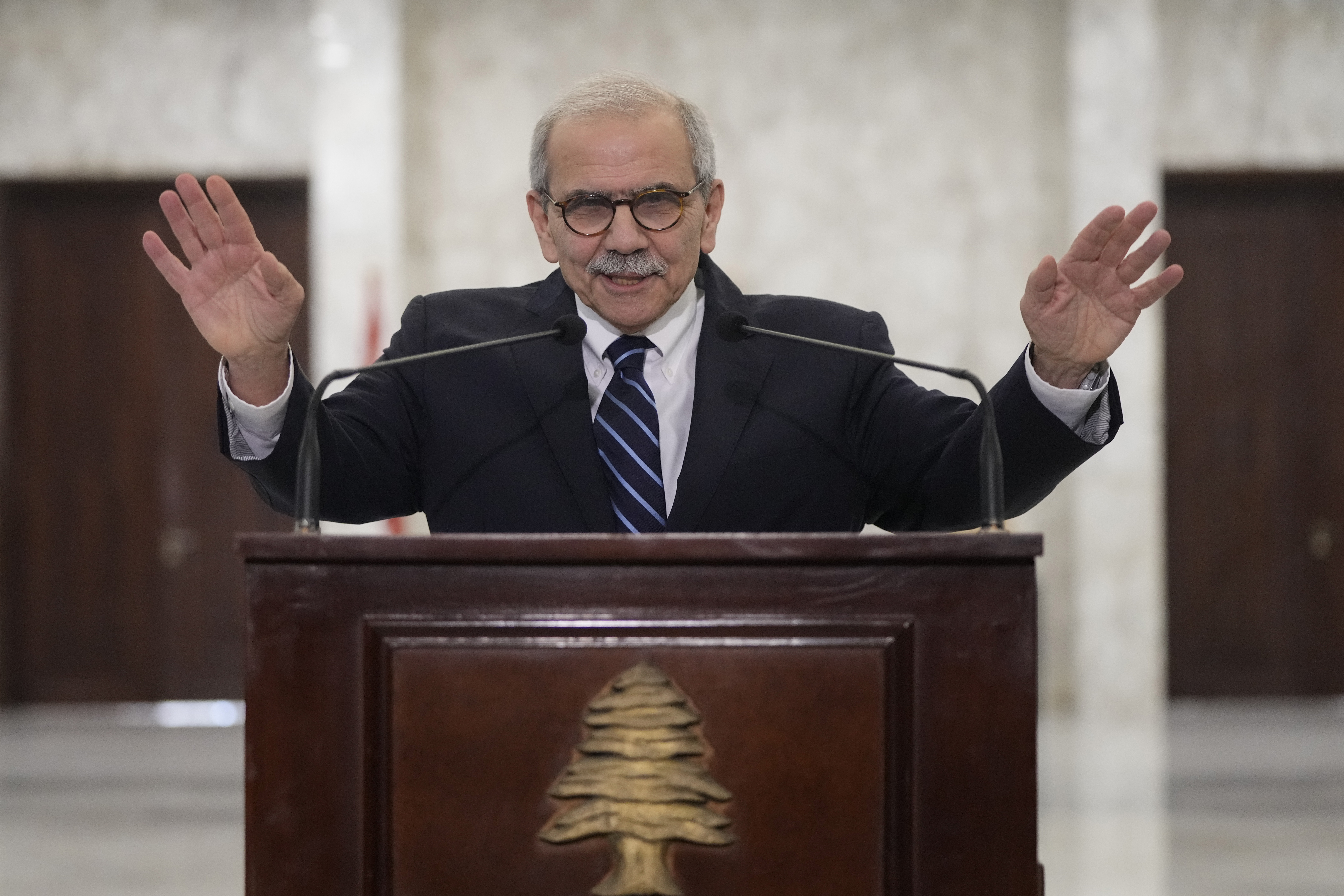 Lebanese Prime Minister-designate Nawaf Salam speaks to journalists after his meeting with Lebanese President Joseph Aoun at the presidential palace in Baabda, east of Beirut, Lebanon, Tuesday, Jan. 14, 2025. (AP Photo/Hassan Ammar)