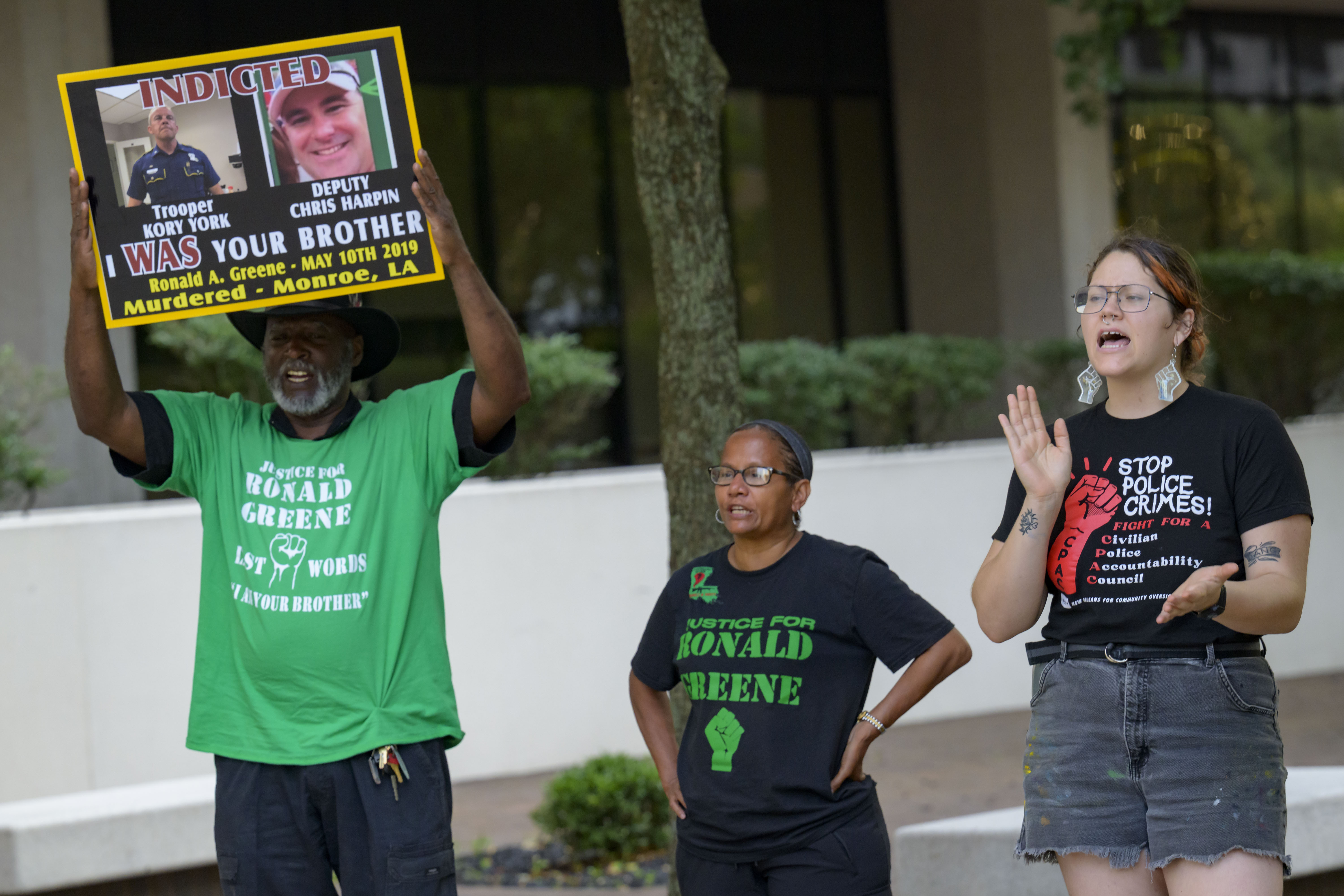 FILE - From left, Lumumba Lutalo, Angela "Mama Ghost" Green and Antonia Mar, of New Orleans for Community Oversight of Police, take part in a rally for justice for Ronald Greene at the Eastern District of Louisiana Courthouse in New Orleans, on May 10, 2024. (AP Photo/Matthew Hinton, File)