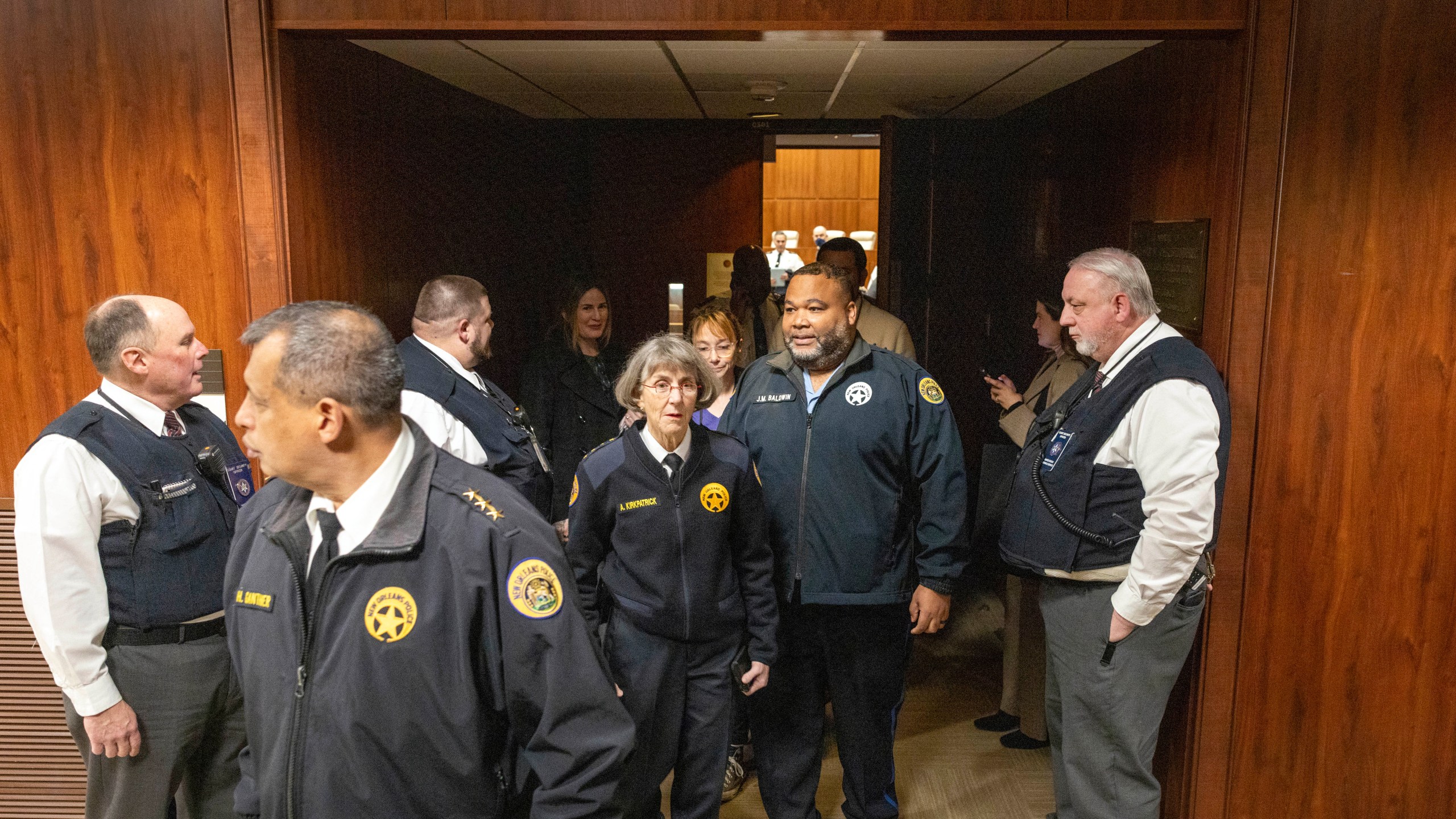 New Orleans Police Superintendent Anne Kirkpatrick, center, along with her NOPD district chiefs, walks out of Federal Court, Tuesday, Jan. 14, 2025, in New Orleans, after a judge ruled the New Orleans Police Department can begin the process of ending longstanding federal oversight. (Chris Granger/The Times-Picayune/The New Orleans Advocate via AP)