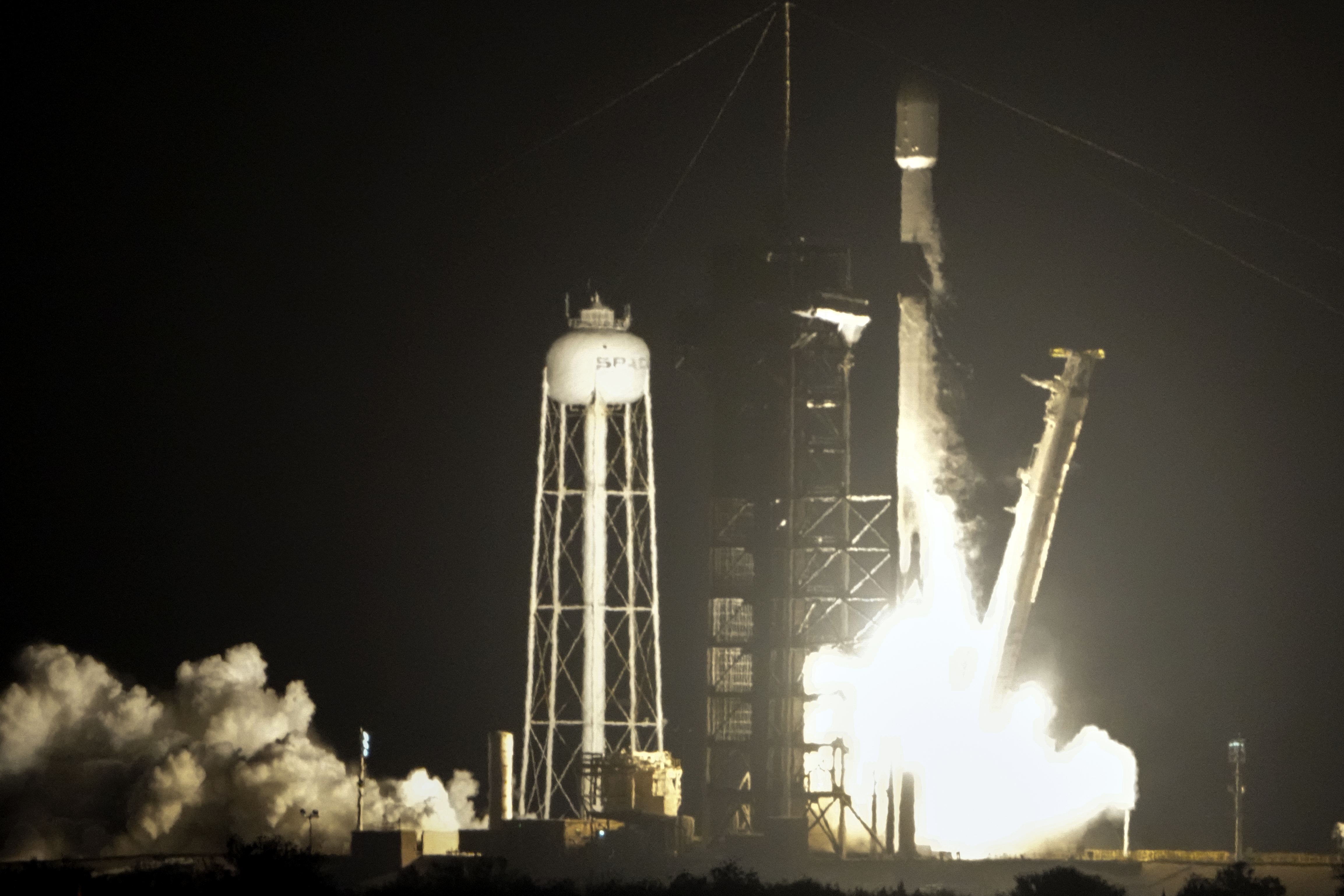 A SpaceX Falcon 9 rocket lifts off from pad 39A with a payload of a pair of lunar landers at the Kennedy Space Center in Cape Canaveral, Fla., Wednesday, Jan. 15, 2025. (AP Photo/John Raoux)