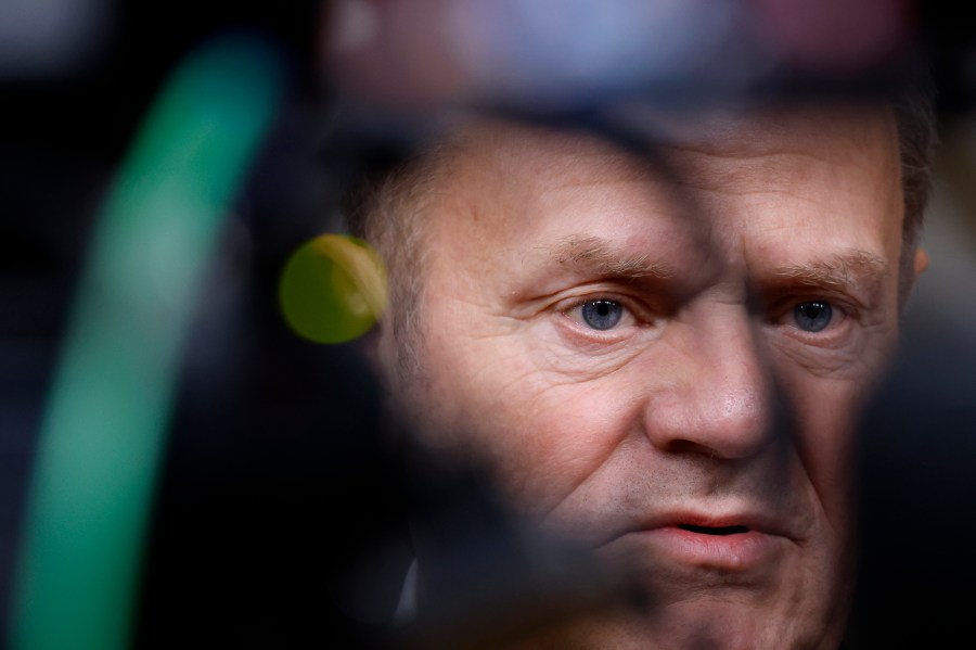 Poland's Prime Minister Donald Tusk speaks with the media prior to a group photo at an EU summit in Brussels, Thursday, Dec. 19, 2024. (AP Photo/Omar Havana)