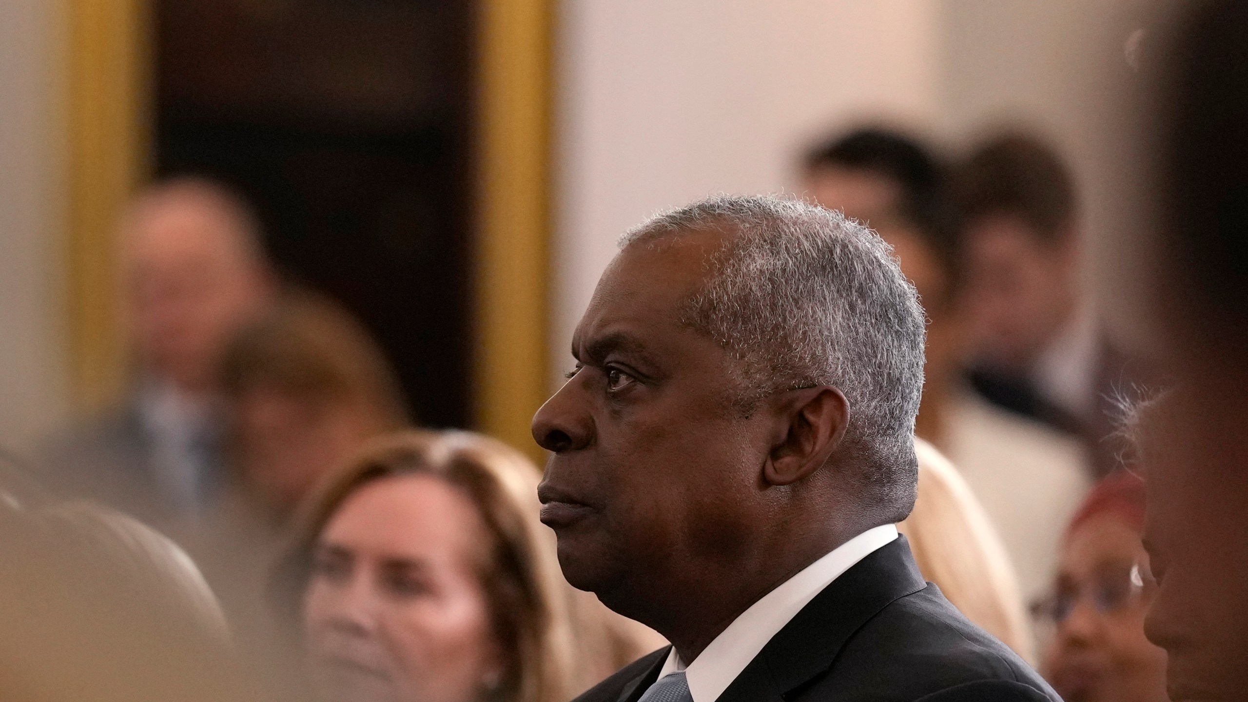 Defense Secretary Lloyd Austin listens as President Joe Biden speaks about foreign policy during a speech at the State Department in Washington, Monday, Jan. 13, 2025. (AP Photo/Susan Walsh)