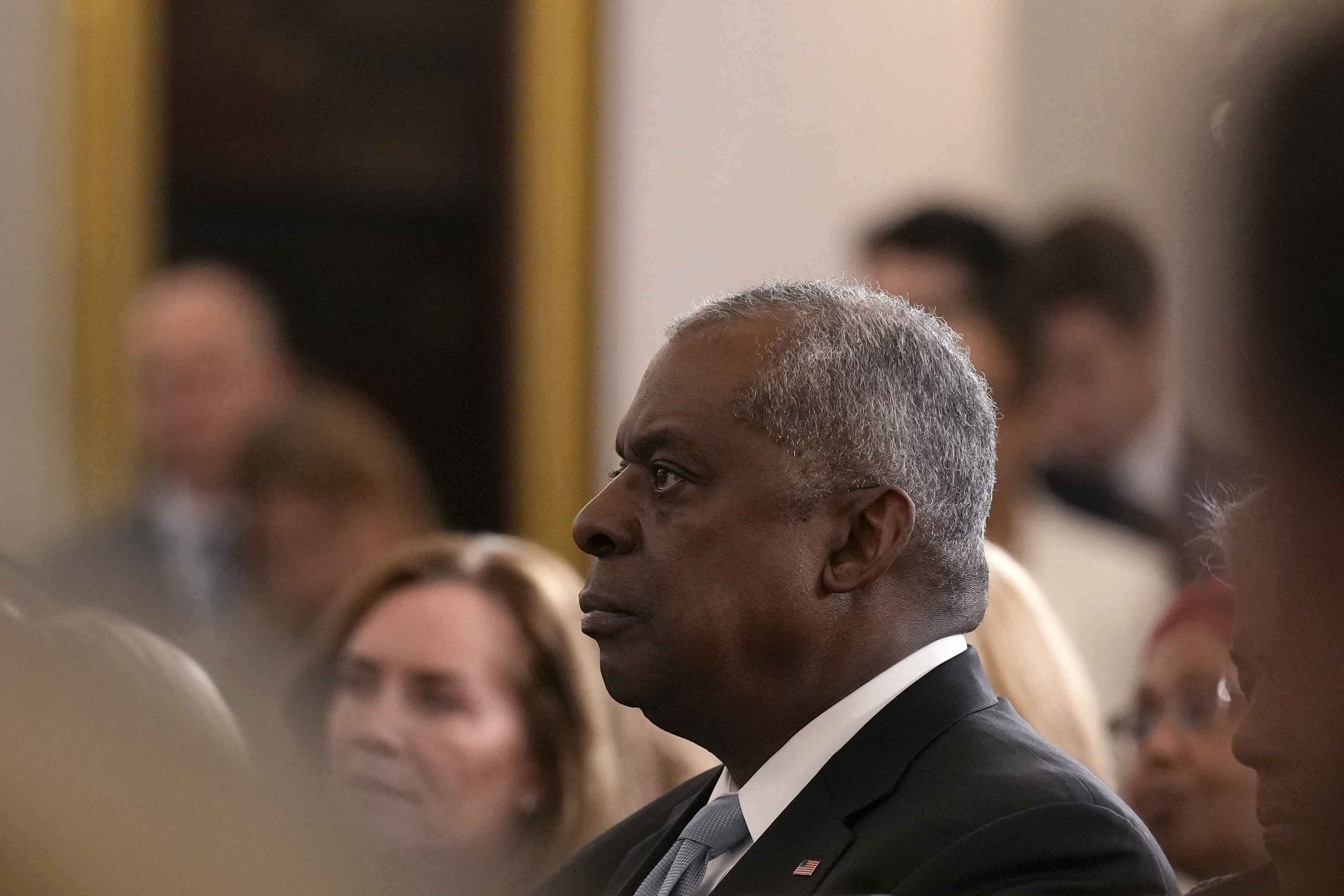 Defense Secretary Lloyd Austin listens as President Joe Biden speaks about foreign policy during a speech at the State Department in Washington, Monday, Jan. 13, 2025. (AP Photo/Susan Walsh)