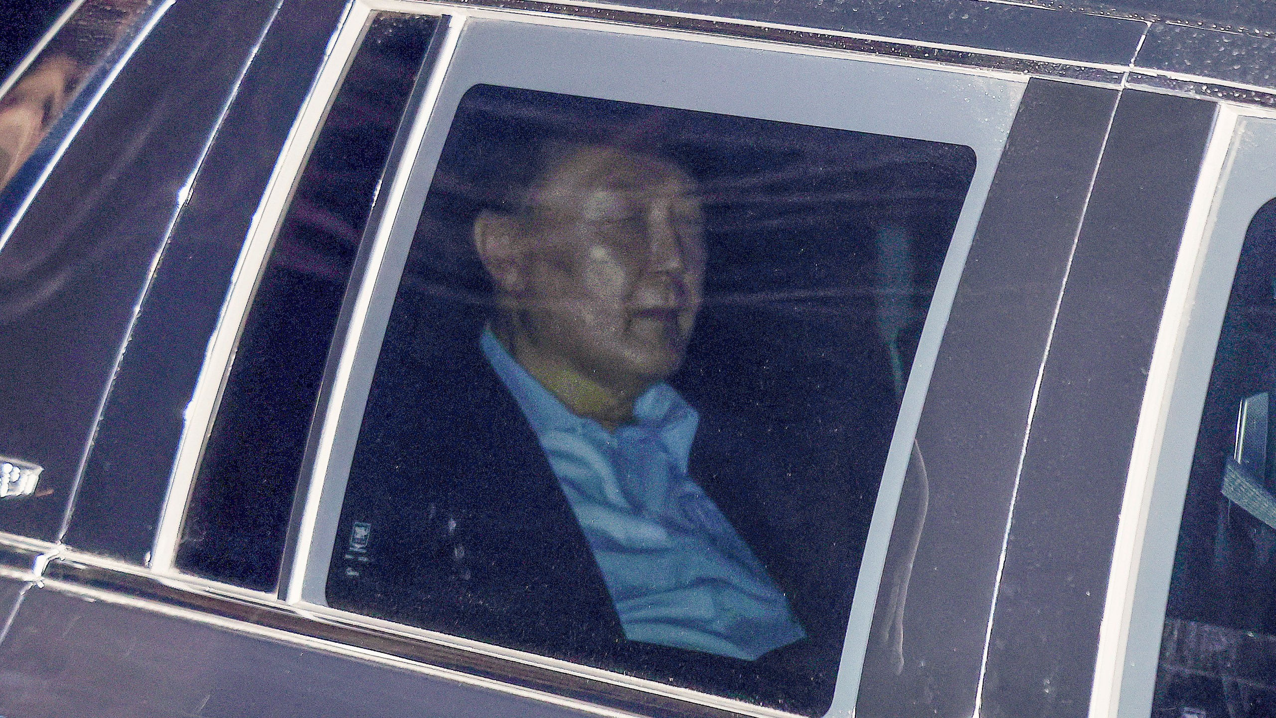 Impeached South Korean President Yoon Suk Yeol, sits in a car as he heads to a detention center in Uiwang, South Korea, Wednesday, Jan. 15, 2025. (Kim Sung-min/Yonhap via AP)