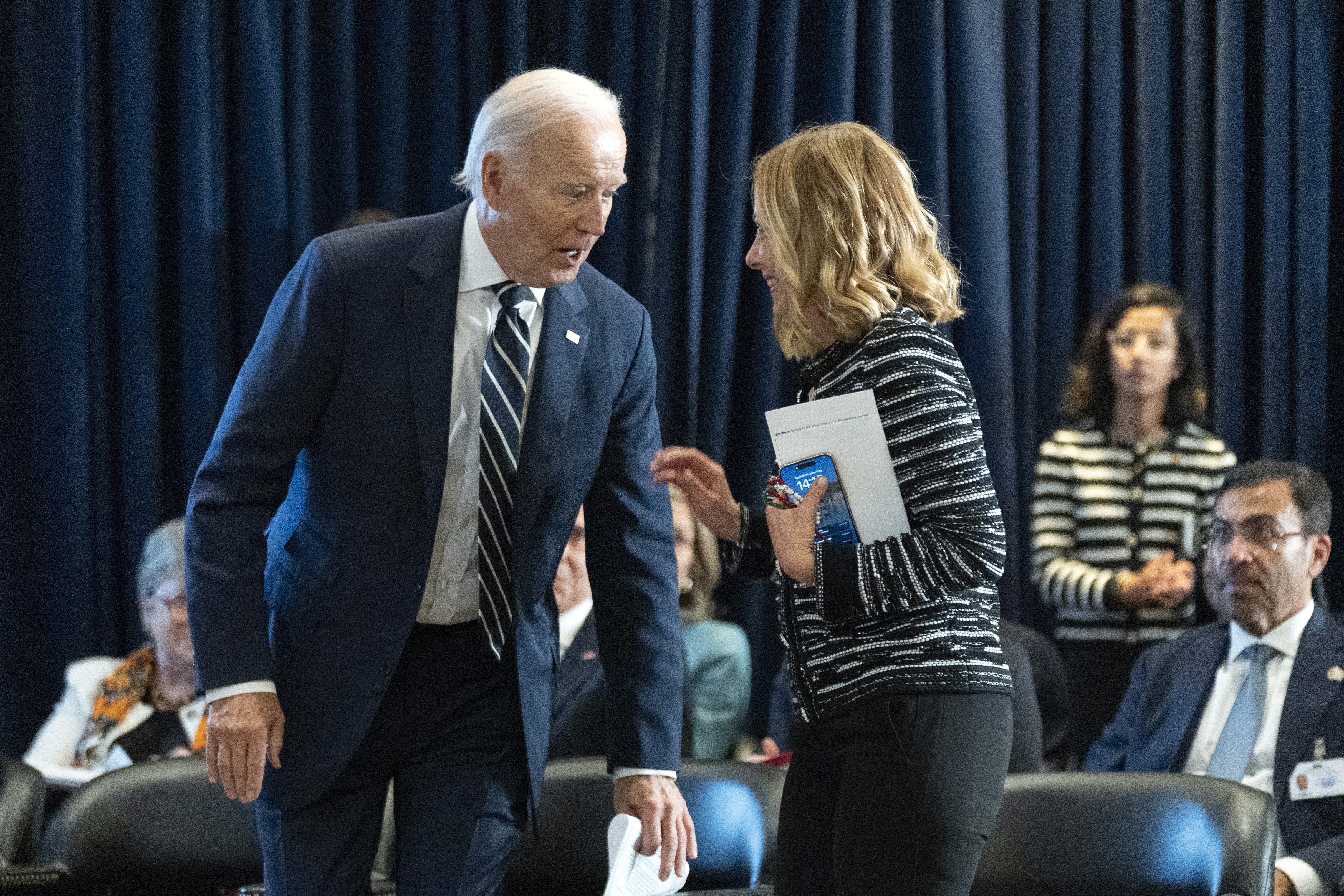 FILE - U.S. President Joe Biden talks to Italy's Prime Minister Giorgia Meloni at the meeting of the Global Coalition to Address Synthetic Drug Threats in New York, Sept. 24, 2024. (AP Photo/Manuel Balce Ceneta, File)