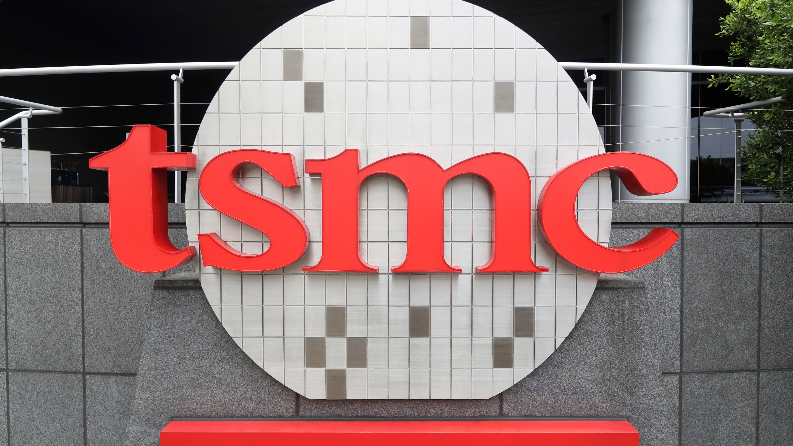 FILE - Taiwan Semiconductor Manufacturing Co., Ltd. (TSMC) logo brands the headquarters in Hsinchu, Taiwan, Wednesday, Oct. 20, 2021. (AP Photo/Chiang Ying-ying, File)